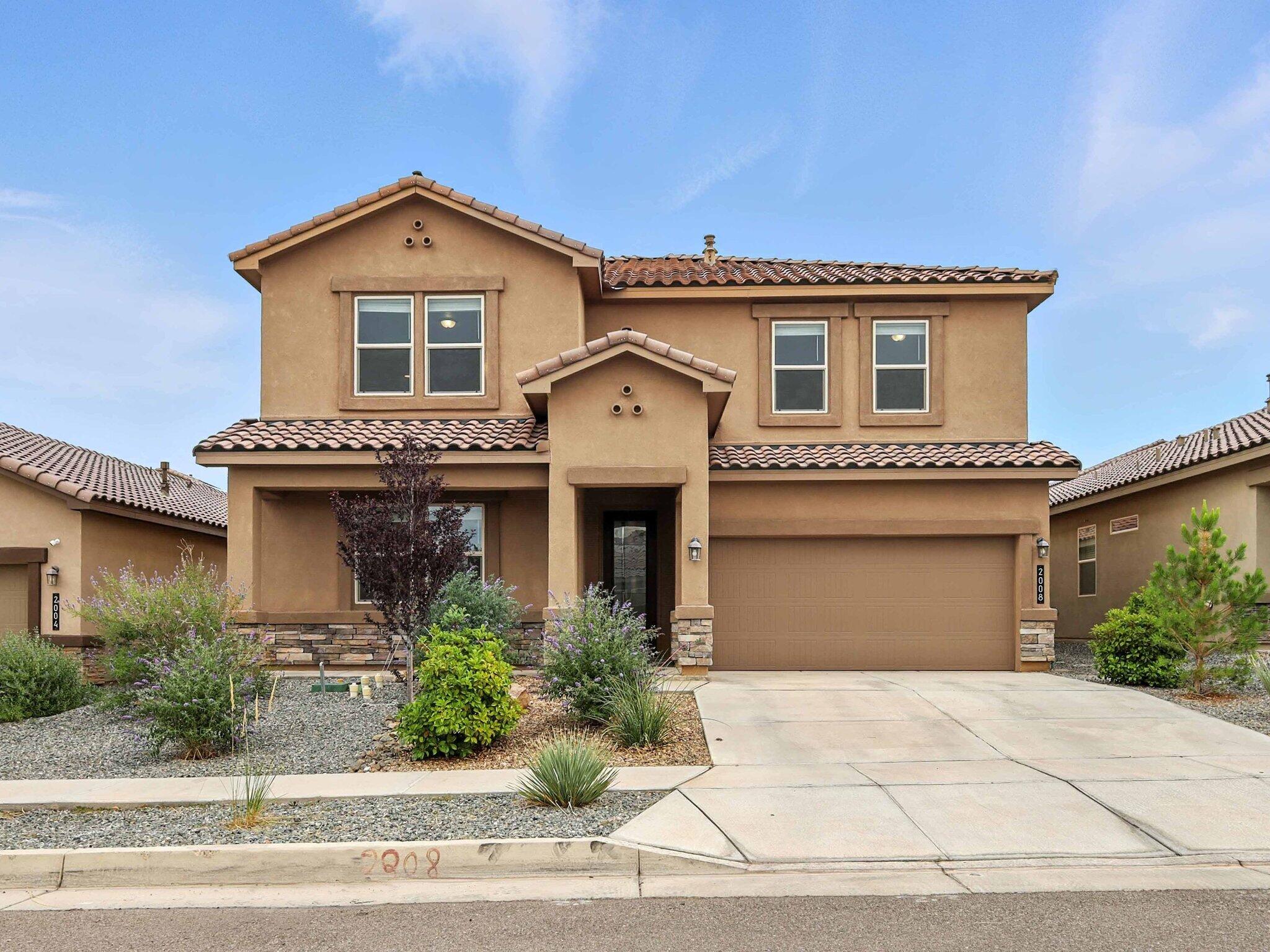 Built just 4 years ago by D.R. Horton, this stylish two-story home is nestled in the desirable Volterra community and offers 5 bedrooms, 3 bathrooms, and refrigerated air. The open-concept layout features a kitchen with granite countertops, stainless steel appliances, a center island, and sleek tile flooring that flows into the cozy living area. Enjoy a spacious loft perfect for an office, hobby, or game room. Smart home features include a central panel that controls thermostats, front door access, lighting, doorbell camera, and more. The garage door is MyQ app compatible for added convenience. The front and backyard are both fully landscaped with low-maintenance turf, decorative rock, and a variety of plants, creating a beautifully finished outdoor space ready to enjoy. Stylish, smart,