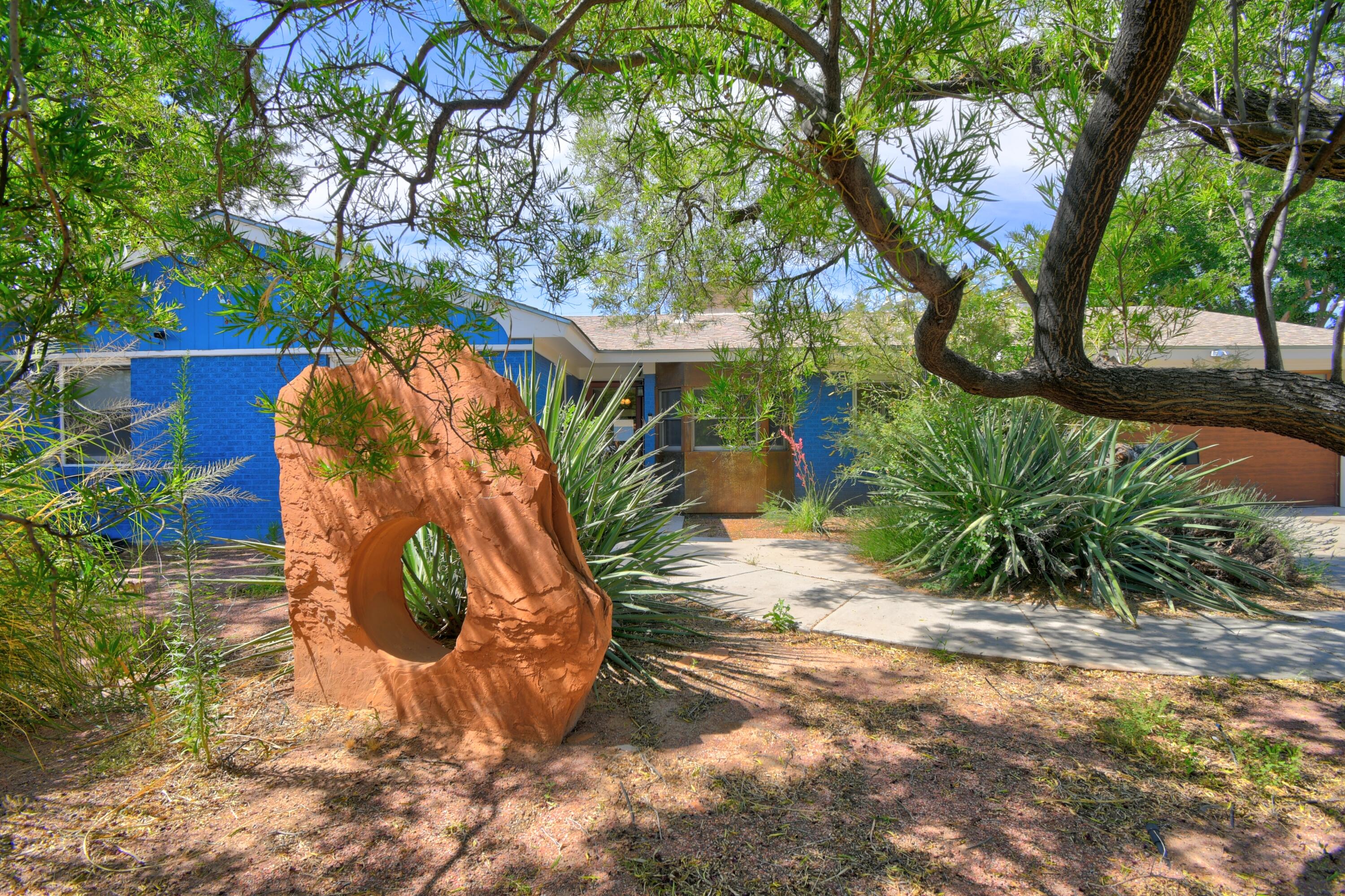 The Blue house- is a lovely Brick home in the Albuquerque Country Club. Pitched Roof, Refrigerated Air, Remodeled with a large Primary Room, and large Primary Bath, Steam shower and jetted tub. New carpet installed in 7/2025 in bedrooms, Lovely engineered hard wood in the living spaces.  Bright and cheerful kitchen, new refrigerator 7/15, lots of windows and light throughout the home.  Two large fireplaces, one in the dining room. Large back yard.  Great Floor plan come see it today.