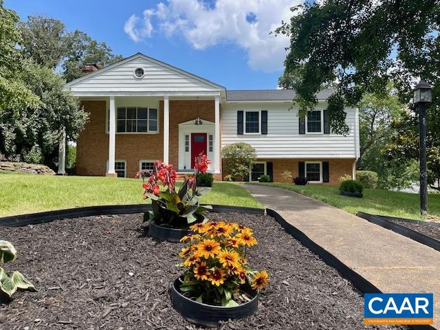 NEW PAINT - NEW FLOORING - NEW ROOF & GUTTERS - NEW interior & exterior doors- NEW WINDOWS. NEW upscale kitchen cabinetry and granite - and all new lighting throughout! HUGE deck and fenced yard for Fido! This home is STUNNING and  MOVE IN READY! UNMATCHED LOCATION in Albemarle! Just minutes from all the best of Charlottesville, this BEAUTIFULLY UPDATED home sits on a spacious CORNER LOT in the sought after neighborhood of Woodbrook, with paved driveway and attached garage. Inside, you’ll find an open floor plan with a BRIGHT living room that opens to a HUGE kitchen featuring a large island with stunning granite and brand-new stainless steel appliances. The main-level primary en-suite includes a newly tiled shower, while two additional bedrooms and a full bath complete the first floor. Downstairs, the finished lower level offers incredible flexibility with a family room, media or rec room, home office, large laundry area, full bath, and a generously sized 4th bedroom. The sunny backyard is perfect for gardening, entertaining, or relaxing on the oversized deck. Walk to school, and enjoy all the perks of city convenience—without paying city taxes!