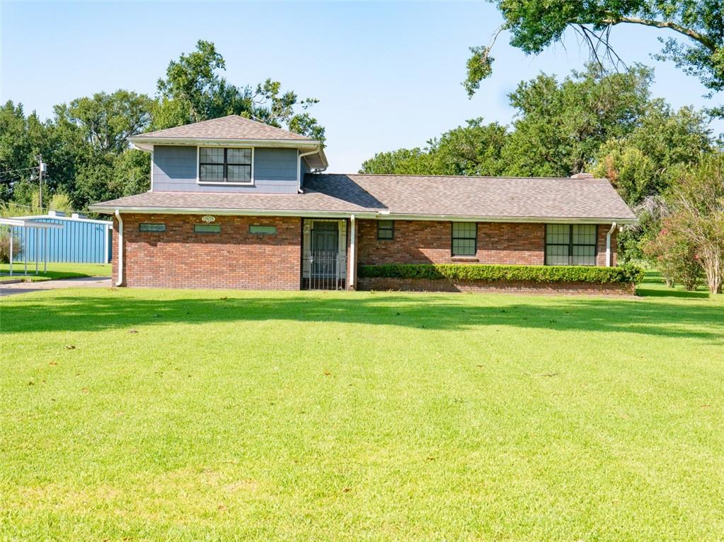 This listing includes 2 separate houses, one at 12625 River Road and 12621 River Road, an extra large metal garage that is 1350 sq. ft, a brick garage with 2 garage doors, a built in swimming pool and pool house, on over 3.6 acres of beautiful land. The brick house (12625) is 2494 sq, ft. with 3 bedrooms and 2 full baths, a study, large den that can be a primary bedroom, living room and sunroom, very large laundry room. Attached carport that fits at least 3 cars. The roof was replaced after Hurricane Ida. The second house(#12621 River Road- Blue house on left) is 1077 sq. ft. of living area. 2 bedrooms and one full bath, living room, and large kitchen, extra room and laundry room and has had some renovations done. Could probably be rented out for at least $1200 per month. Behind the blue house is a very large metal building that measures 45x30 (1350 sq.ft.) with 2 large garage doors. would be good as workshop or to house cars. There is another brick garage/workshop that is 35x12 (420 sq.ft.) There is an inground pool and a pool house that needs some TLC. Both properties have separate addresses but sellers would like to sell as one package. Not many places in the area where you can buy over 3 acres of land. The measurements are 50.35/50.76x1043.3/1040.3 (1.2 acres) on the left with blue house, 100.70/101.52x1049.3/1046.3 (2.43 acres) on the right with the brick house. From River Road to the tracks and from utility poles on left side to fence on right side. Dimensions and answers to questions on this listing pertain to the brick house.