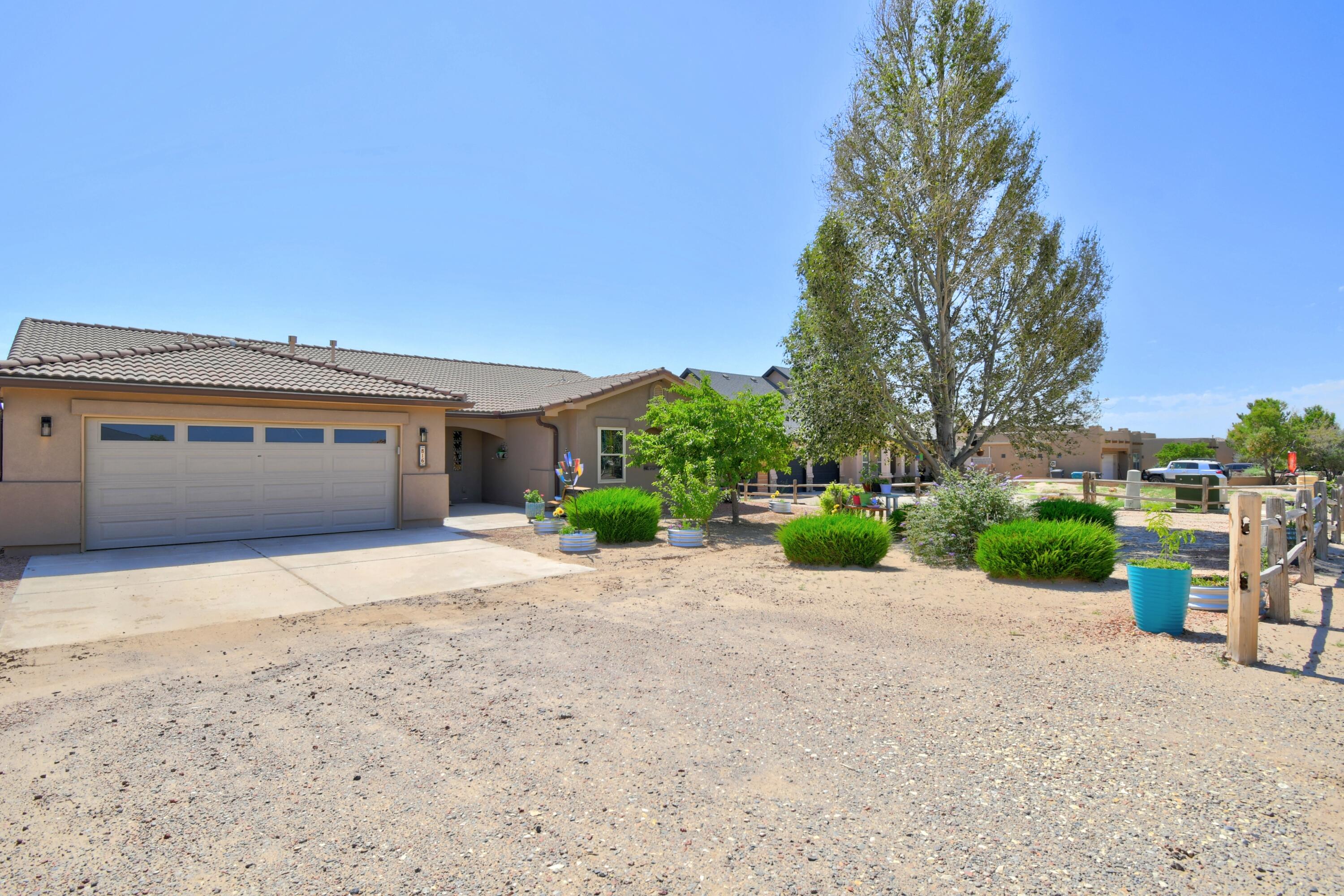 Discover this wonderfully kept 3-bedroom, 2-bath home in NE Rio Rancho, situated on a spacious half-acre lot. Enjoy an open floor plan with a formal dining area, refrigerated A/C, and new windows. The exterior boasts a tile roof, oversized 3-car garage, covered rear patio with a sunshade awning, and owned solar panels for remarkably low electric bills. A large workshop with power is located on the back of the property, and the beautifully landscaped yard features raised flower beds, ready for you to enjoy.