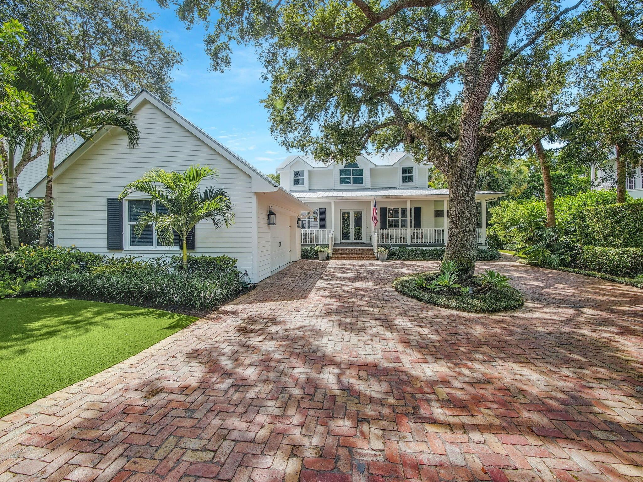 Nestled in the 17 residence secluded Natures Hideaway neighborhood in Palm Beach Gardens, this custom built & meticulously maintained 4BR/3BA + den, loft, pool & detached 2-car garage CBS home is turn-key & ready for its new owner. Majestic 100-year-old oak trees and palms line the quiet one-way street that welcomes you as you enter the communities' gates. Situated on a roughly 1/2 acre lot, the long Chicago brick paver driveway and pristine landscaping lead you to the relaxing front porch. Once through the double-entry French doors a pretty fireplace & sitting area greet you. The open kitchen is a chef's paradise with plenty of counterspace, storage & center island ideal for food prep & conversation. The stainless steel appliances include a gas stovetop for optimal cooking. The luxurious first floor master bedroom suite has a spacious bathroom &amp; French doors that lead you to the relaxing pool area. The beautiful wood staircase leads to the roomy loft area &amp; two large guest bedrooms that share a Jack &amp; Jill bathroom. The guest bedrooms also have walk-in closets &amp; cozy window seats. The fourth bedroom is located downstairs with French door access to the backyard. The backyard porch overlooks the saltwater pool/spa, lush landscaping &amp; is the perfect way to unwind. On cooler nights, relaxing by the fire pit is the way to go. The detached garage has AC, lots of attic storage, epoxy flooring, custom built shelves &amp; a covered walkway to the main house. This high-end home features high end finishes throughout including impact windows/doors, hardwood floors, wainscotting, crown molding, custom built cabinetry, soaring ceilings with recessed lighting, plantation shutters, phantom screens &amp; exterior artificial turf throughout. Some furniture is negotiable. 
Natures Hideaway feels like living in a nature preserve in Key West but is located in the heart of Palm Beach Gardens. This community is close to restaurants, the Gardens Mall, beaches, golf courses, 95 and Florida's Turnpike.