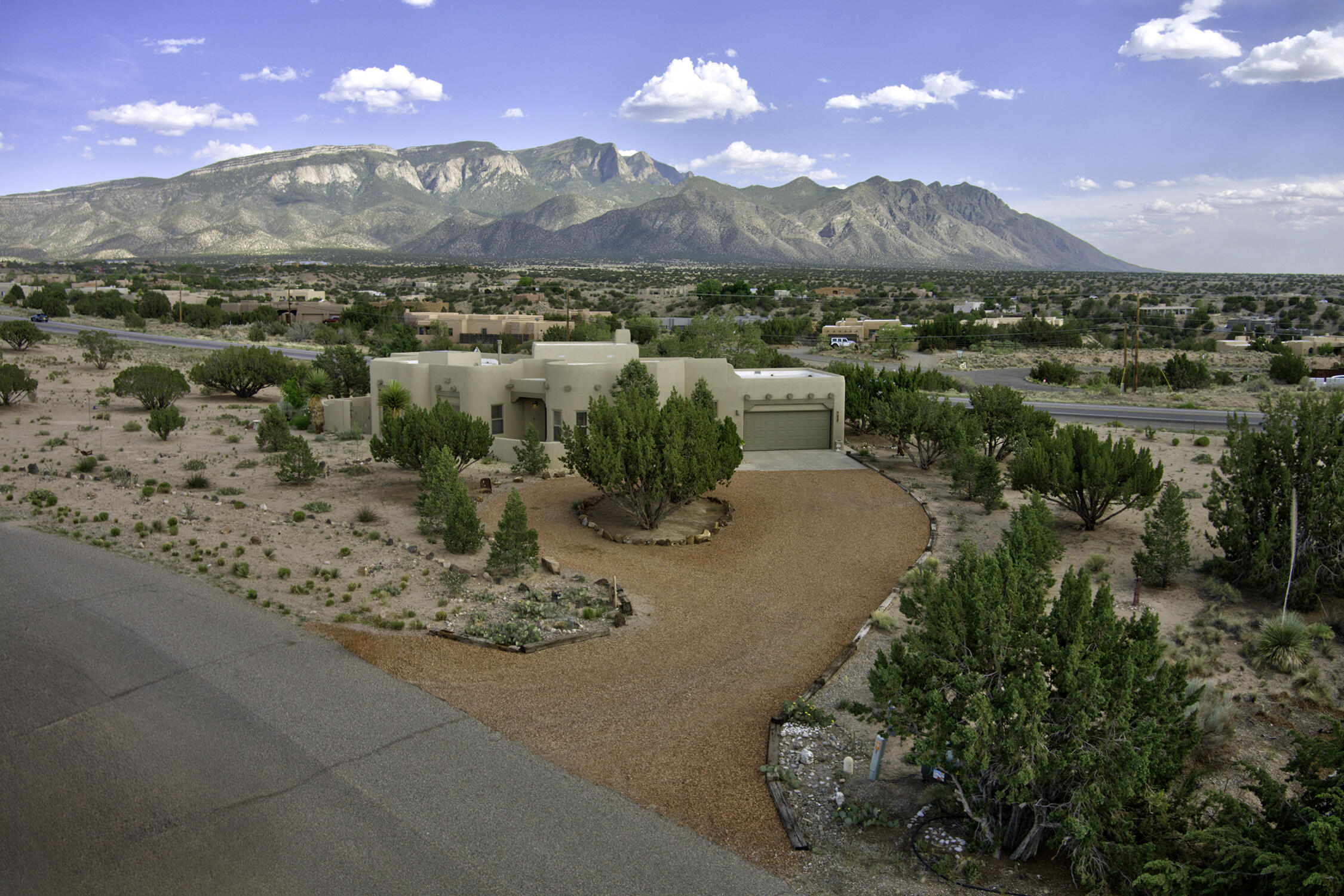 **Note: 48 hour right of first refusal in place.**Set against the breathtaking backdrop of the Sandia Mountains, this distinctive custom residence offers a seamless fusion of timeless Southwestern charm and modern sophistication. Perfectly located in Placitas' premier community--The Trails--you'll enjoy a coveted lifestyle just minutes from Albuquerque, with nearby walking paths and a warm neighborhood spirit.