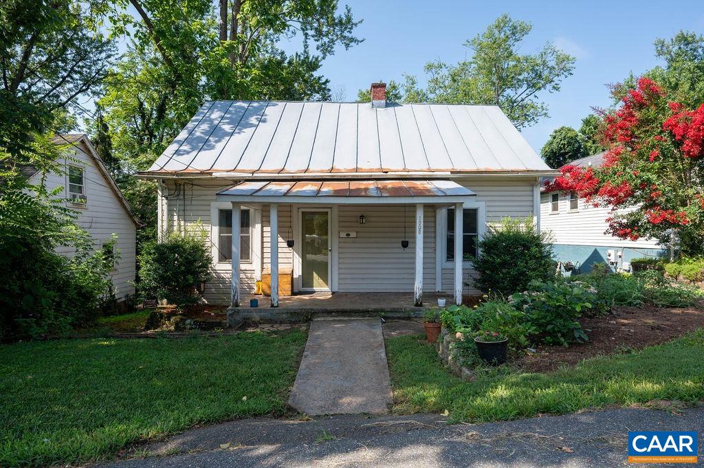 This cute city bungalow is larger than it appears! Located on a sweet, quiet street just off of Locust Avenue this home offers 3 Bedrooms and 2 full baths in just over 1100 square feet. Standout features include a metal roof, replacement windows, and a newer hot water heater. Plumbing and electric updated. Laundry and pantry area on the main level conveniently located adjacent to the generously sized kitchen. Nice rear yard.