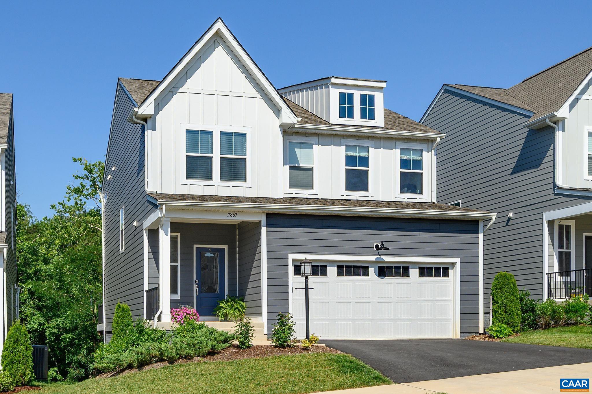 Sparkling, stylish, low-maintenance 4 BR, 3.5 BA home overlooking a babbling brook in vibrant Crozet neighborhood! The abundant natural light and thoughtful, open layout make this home feel comfortable and inviting. Tasteful, sophisticated finishes deliver a chic, contemporary vibe throughout. The kitchen shines with supersized island, gleaming custom tile, Carrera quartz, and high-end appliances. So many extras, including convenient mudroom, loads of storage, and a flex space off kitchen for expanded pantry or homework center. Enjoy wooded views  from the family room or relax on the composite deck (with motorized awning!). Handsome open, turned staircase leads to a flexible 2nd-floor loft—perfect for living area, playroom, or office. Luxe primary suite offers spa-like shower, double vanity, walk-in closet, and nearby laundry room. Two secondary bedrooms have walk-in closets too. The mostly finished walk-out basement features bright rec room, bedroom and full bath. This 2023 home is better than new thanks to extensive upgrades and thoughtfully selected design elements. This friendly neighborhood offers trails, clubhouse, fire pits, grills, and play spaces. Walk to downtown Crozet, restaurants, shops, library, and top schools.