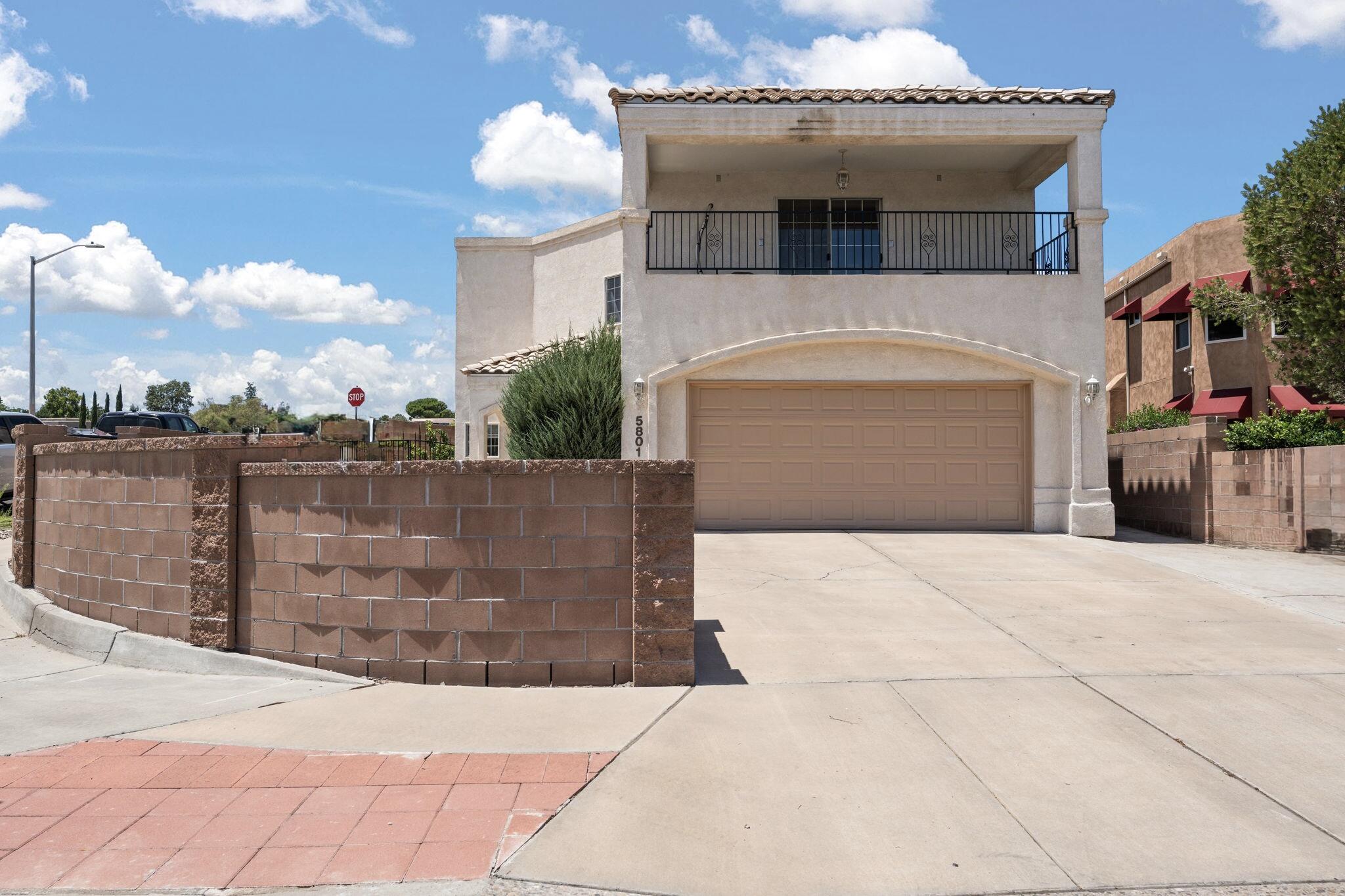 Welcome to 5801 Tres Vista Ct NW! An inviting home with high ceilings, updates throughout, and views. Enjoy stunning sunrises and sunsets from two redone decks (2024), both with direct access from bedrooms. Stay cool with an evaporative cooler installed in July 2025, plus a split unit in the primary bedroom for added comfort. Stucco touch-ups completed in 2024 enhance curb appeal. Conveniently located near, shopping, dining, and only 0.3 miles to Coors. This home offers a functional layout, thoughtful updates, and an ideal location. A must-see!