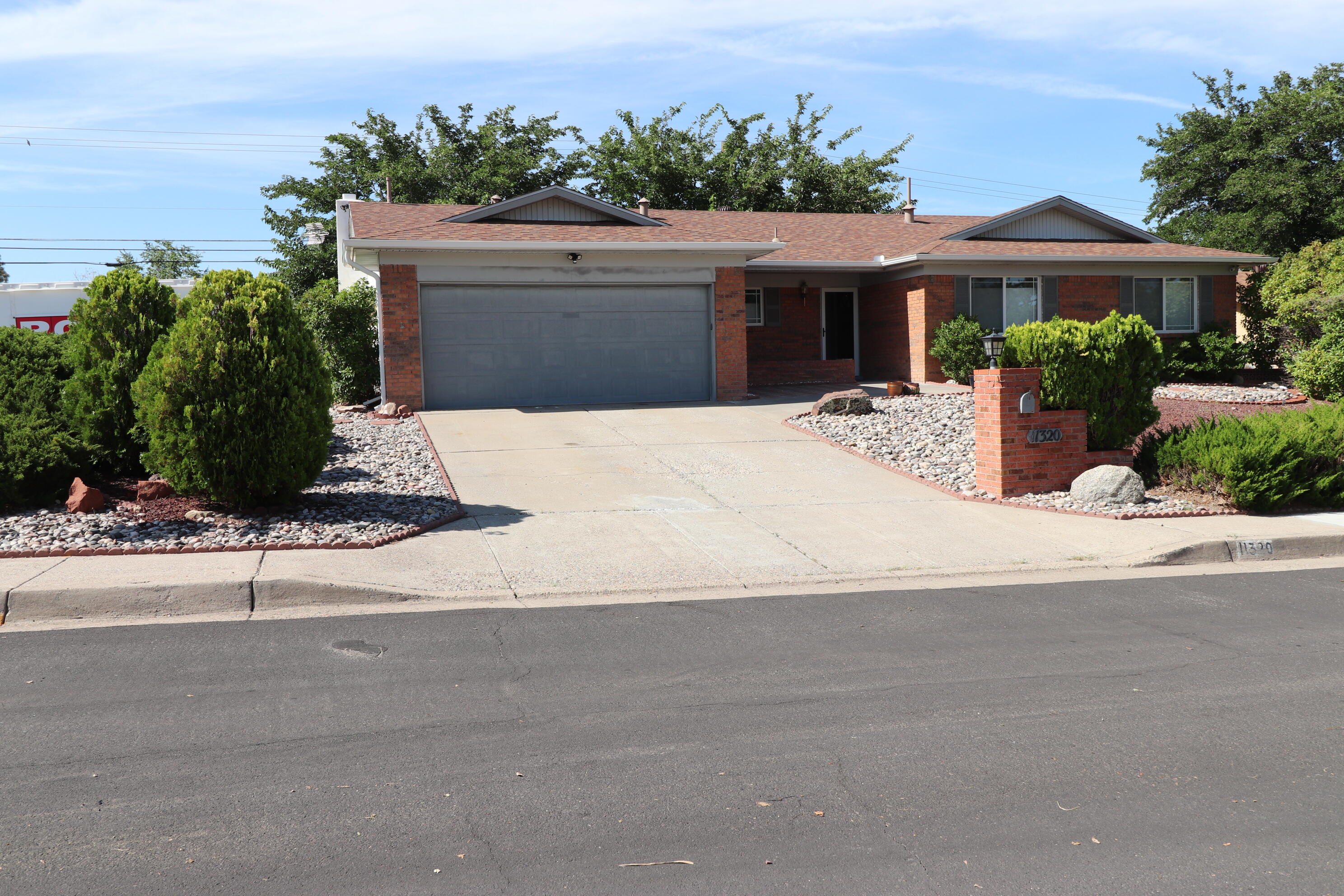 Seller is relocating soon & is motivated to sell!! This home has been remodeled and improved with an open floor plan.  It also has RV parking behind a solar powered gate and two storage sheds - one is finished inside (see photos) with AC and electric perfect for a workshop or extra work space.  Large corner lot offers lots of benefits for extra parking and access.  LR has built-in desk  with storage.  No carpet - flooring is tile or wood.  Updates include: Upgraded electrical. roof, CFA/refrigerated AC, thermal windows, blown in insulation in attic, 50 amp in garage for electric car, vanities with granite tops in both baths, to die for kitchen with granite, under cabinet lighting, Stainless Steel appliances. and so much more!!   Title Alliance of NM-Tara Ross.