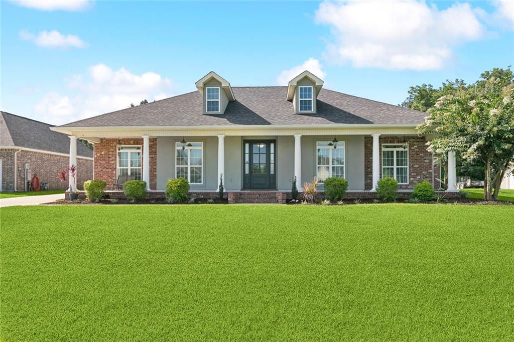 Welcome to your dream home! This spacious 4-bedroom, 3-bath residence offers 2,594 sq ft of comfortable living space, perfect for everyday living or those who love to entertain. Nestled on a generous 100x156 lot, the home boasts a versatile bonus room—ideal for a home office, playroom, or guest space.

Enjoy the convenience of a covered carport with attached storage, plus a large covered area perfect for boats, campers, or additional vehicles. The expansive yard offers plenty of room to relax, garden, or play.

With a functional layout, ample natural light, and room to grow, this property blends everyday comfort with practical amenities. Don’t miss this rare opportunity to own a home with space, storage, and flexibility all in one!