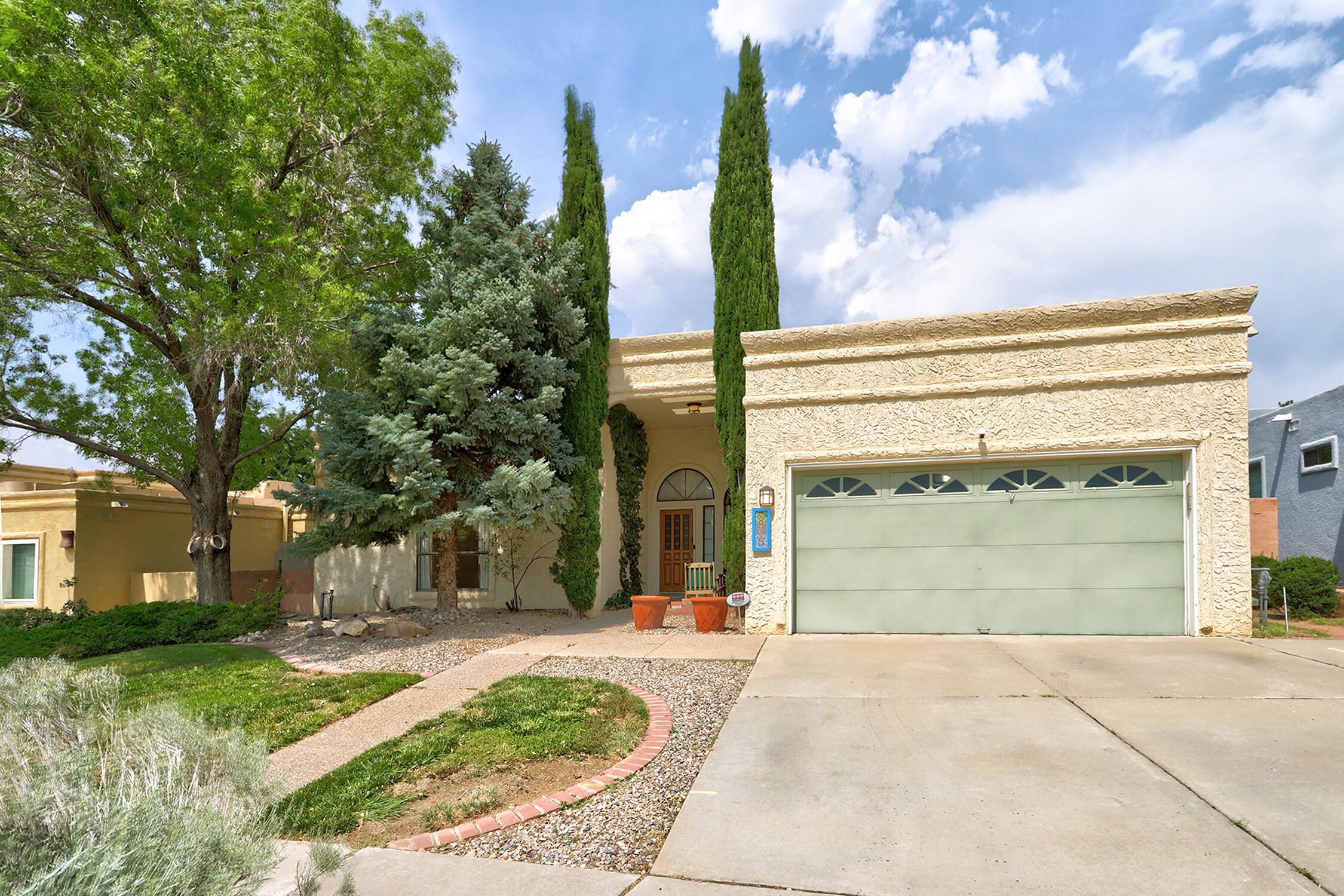 Come fall in love with this Heritage East gem on a HUGE 0.41 ACRE LOT with MOUNTAIN VIEWS! Natural light boasts through the open floor plan. This well maintained home has luxury vinyl plank flooring throughout! Enjoy mountain views from living room and primary bedroom! The generously sized primary bedroom offers direct access to relax on the back patio, a huge walk-in closet and spacious bathroom with dual vanity and separate shower/tub. The kitchen offers stainless steel appliances and tons of storage! RARE FIND with expansive backyard overlooking the stunning Sandia Mountains- Plenty of room to relax, play or garden, plus a workshop with power and a large storage shed.  Finished garage with epoxy flooring. Just steps away from the fabulous Rotary Park! Welcome Home!