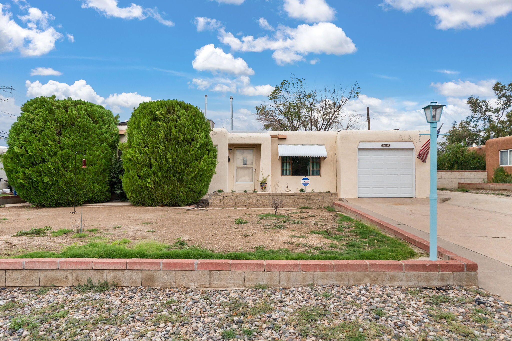 NE Heights Jewel! This home is sunny and bright, offering incredible views of the mountains, along with sightings of roadrunners, hummingbirds, & native plants. It features 8 Poulin solar panels (installed in Oct 2018) & an automatic garage door for one car (installed in 2025). There are no direct neighbors to the north or south of the home, providing a heightened sense of privacy. The location is ideal for a variety of functions & activities in the city!