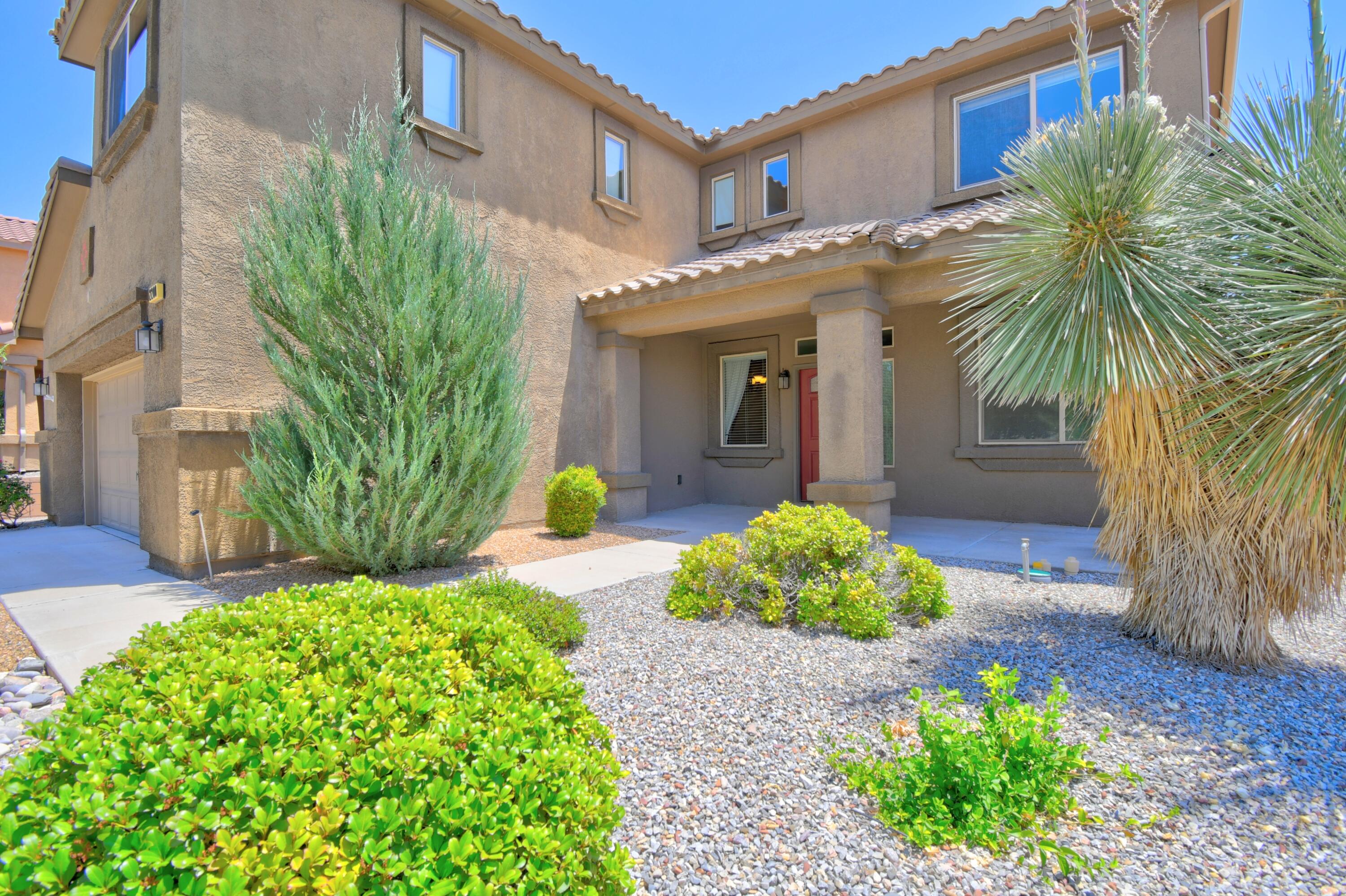 Welcome to this spacious 5-bedroom, 3-bath home in the highly desired Cabezon community! Boasting 3,558 sq. ft. of open-concept living, this beauty features two living areas, two dining spaces, a huge loft, tall ceilings, and a lovely gourmet kitchen with an island and abundant cabinetry. Elegant wrought iron stair railing adds a touch of sophistication. The large primary suite offers a massive walk-in closet and a stylish updated bathroom. Enjoy relaxing evenings on the oversized patio backing to the Linear Park Trail, complete with a hot tub & water feature! An oversized garage provides extra storage. This home truly has it all--space, style, and location!  It's the perfect place to hang your heart!  Great lot with no neighbor directly behind and views of the Sandia's.