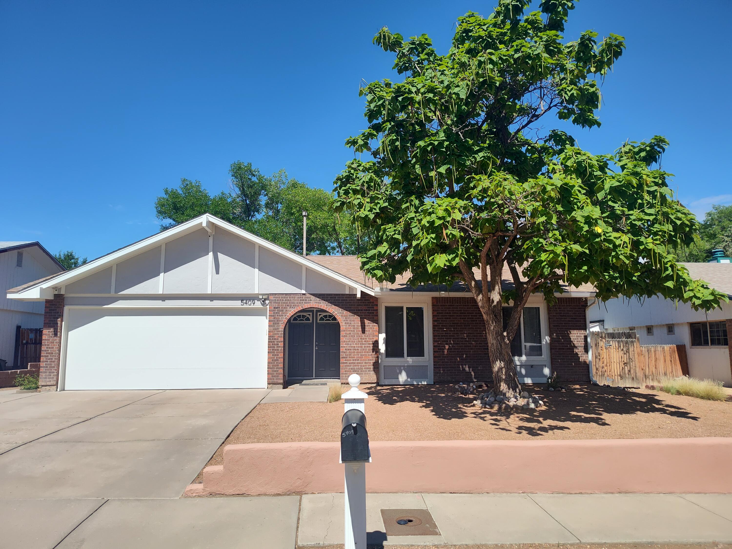 This is a Taylor Ranch single story beauty with 3 bedrooms, 1.75 bath, and a 2-car garage.  Lots of updates inside and out, with an open floor plan that is ready to go!  There is fresh paint, new flooring throughout, ceiling fans, updated bathrooms and an eat-in kitchen with a brand-new dishwasher and breakfast bar island. The roof and water heater are newer, and there is a wood burning stove for cozy nights in the comfortable living area overlooking the gorgeous back yard.  The green grass and mature trees make it perfect for family gatherings and BarBQ's.  Also, there is a garden area with a small green house for those with green thumbs.  Ultimately, the large lot is located on a quiet street in this highly desirable neighborhood.  It is clean, Clean, Clean and move-in ready!