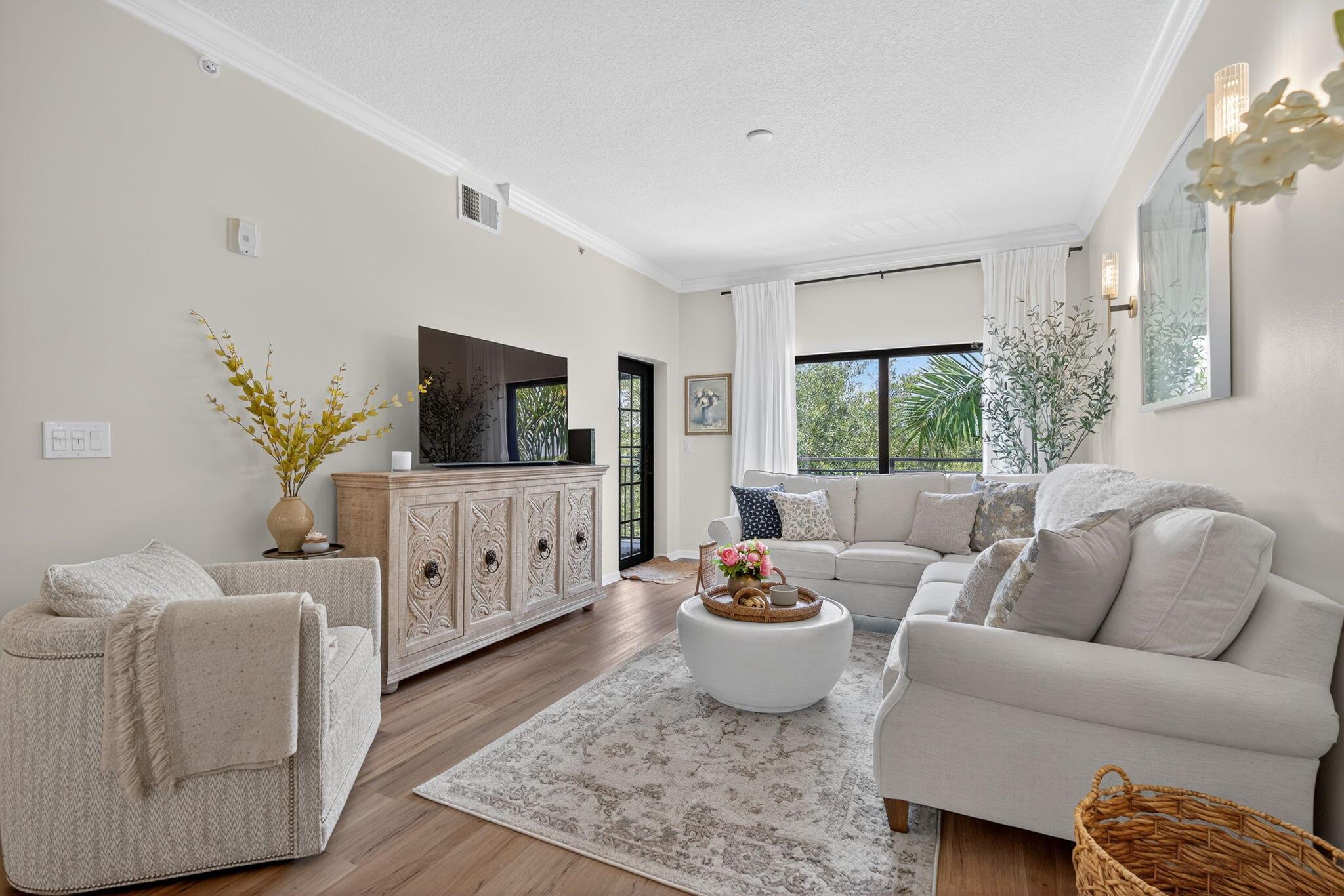 Luxury living in the heart of Palm Beach Gardens! This top-floor, 2BD/2BA condo features soaring ceilings, high-end finishes,  and a private balcony with tranquil views. Located in the upscale Residences at Midtown, enjoy a secure gated entry, private lobby, elevator, resort-style pool, elegant clubhouse, fitness center, and business lounge. Walk to fine dining, boutique shopping, and entertainment. Minutes to beaches, golf, and all that PGA Blvd offers.