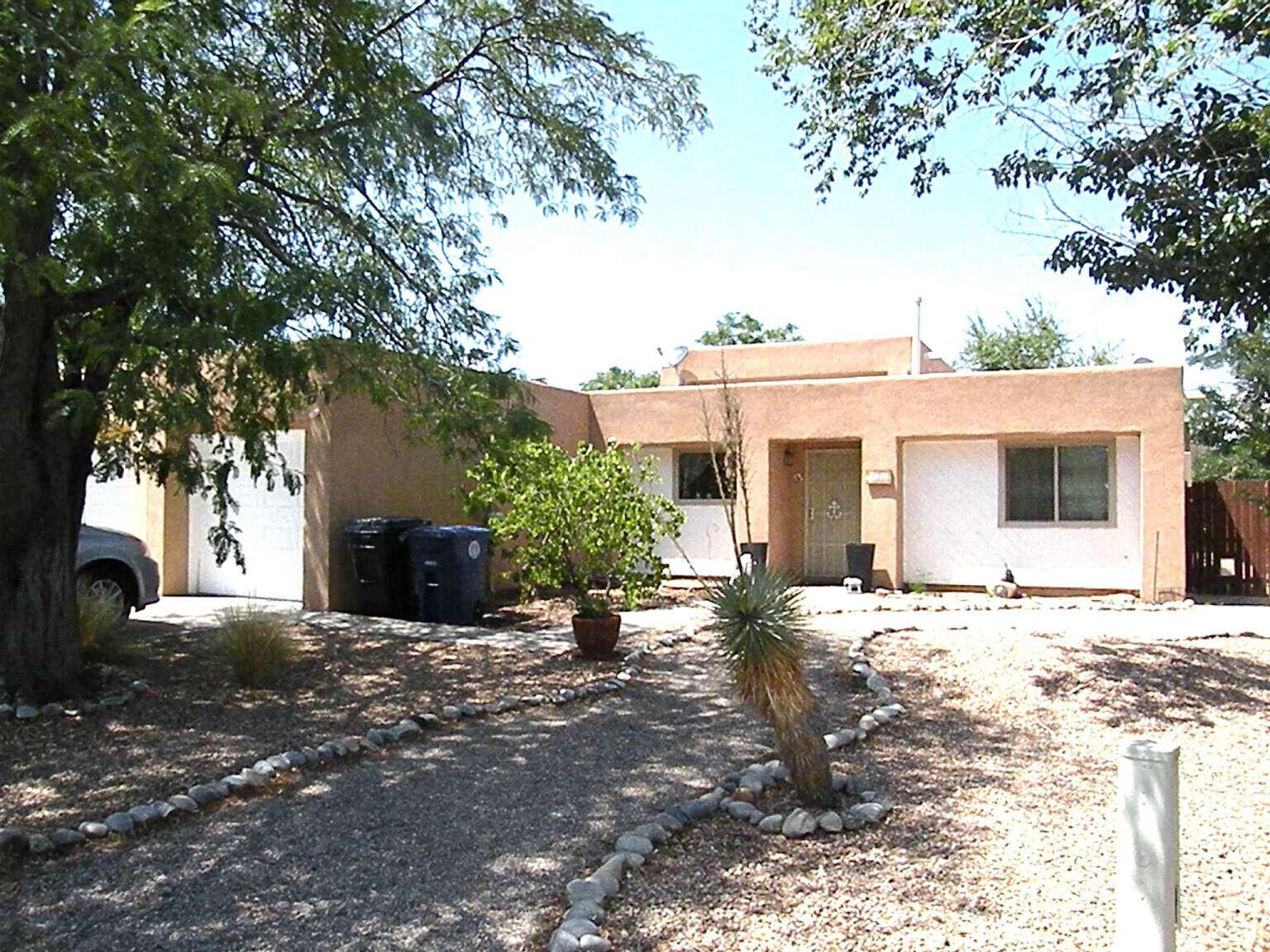 This charming 2/1/1 car garage townhome features a great room with soaring ceilings and abundant natural light, enhanced by French doors leading to a private patio. Recent updates include oak laminate in the bedrooms, wood-look vinyl in the utility room, and recently repainted stucco and trim. The bath features a new tiled shower. Sitting on an oversized lot, the xeriscaped backyard is surrounded by 3 tall fences for privacy and has several patio areas. The front yard has also been professionally xeriscaped, and both front and back have shade trees. This property has its own space, surrounded by long-time residents. It's conveniently located adjacent to a neighborhood park and near Ladera Municipal Golf Course and bike trail.