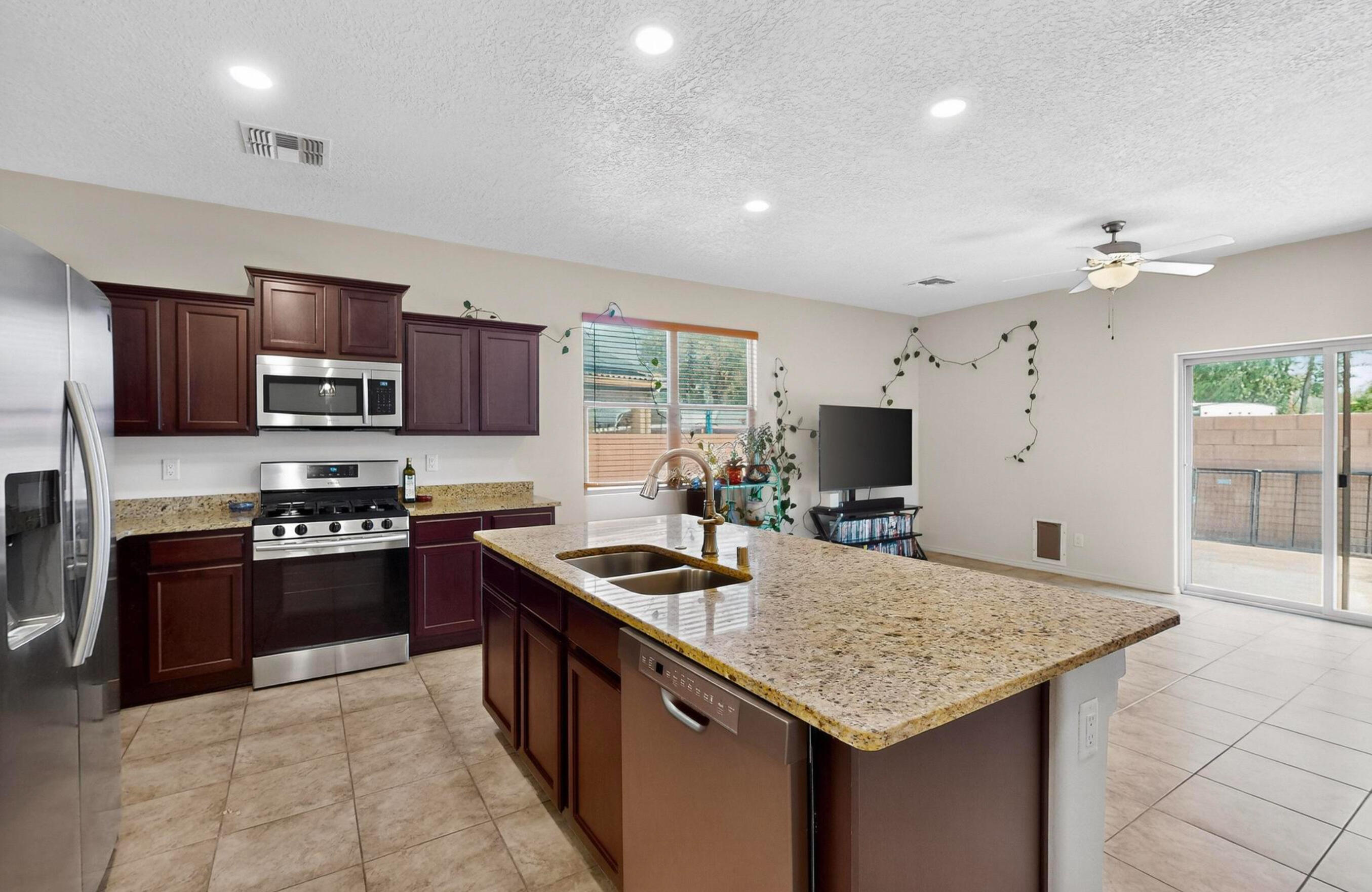 Welcome to this beautifully cared-for home in the desirable Joya Escondida gated community, nestled in the South Valley. Built in 2020, this single-owner residence features 3 spacious bedrooms, 2  bathrooms, and a thoughtful layout designed for comfort and functionality.Enjoy tile and LVT flooring throughout, a two-car garage, and the efficiency of owned solar panels--a bonus for eco-conscious living. The wrap-around landscaped backyard includes a large storage shed, perfect for hobbies or a workshop.The primary suite boasts a lovely soaking tub and a separate walk-in shower, offering a private retreat at the end of the day. With refrigerated air to keep you cool year-round and every detail lovingly maintained, this home is truly move-in ready! Don't miss this rare opportunity