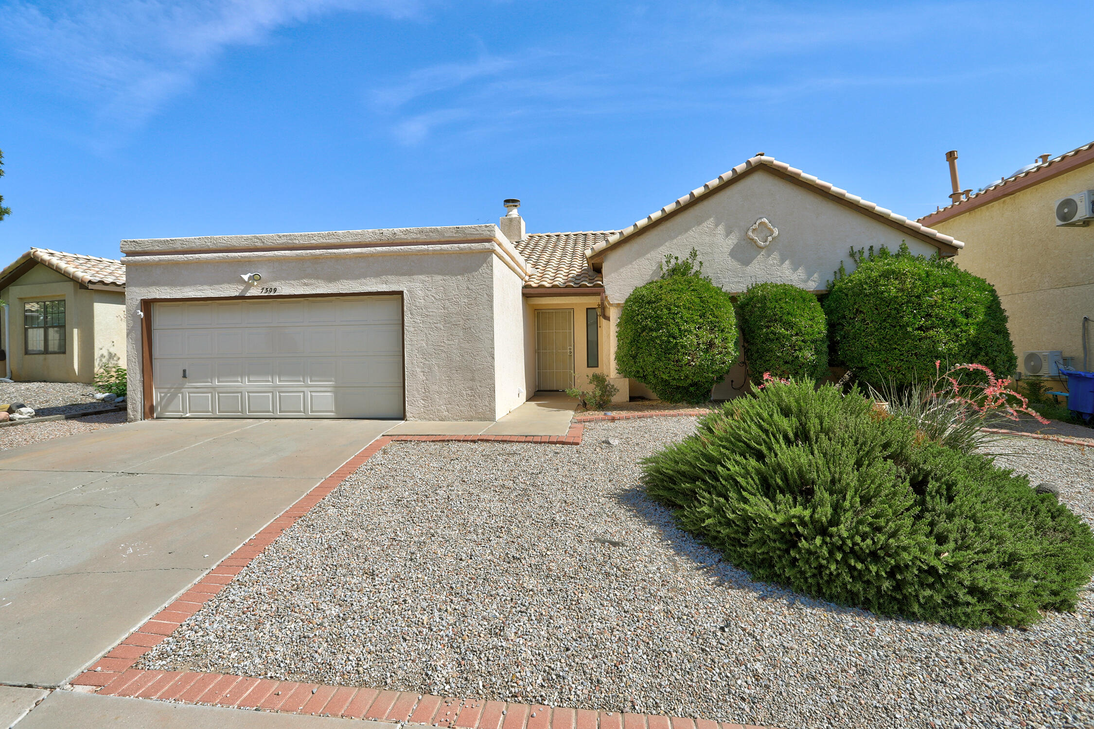 A Must-See Westside Gem! This 3-bedroom, 2-bath home features a smart, open floor plan and a vaulted ceiling in the great room that creates a bright, welcoming space flowing into the kitchen and dining area--perfect for relaxing or entertaining. Cozy up by the 3-way fireplace during cooler months. The spacious primary suite offers a comfortable retreat with a walk-in closet. Kitchen boasts new counter tops, sink and faucet!  New and updated flooring through-out.  New cabinets installed in bathrooms.  Step outside to a low-maintenance, mostly xeriscaped backyard with a shaded patio--ideal for enjoying summer evenings. This home offers great potential and is ready for new owners to make it their own. Schedule your private showing today!