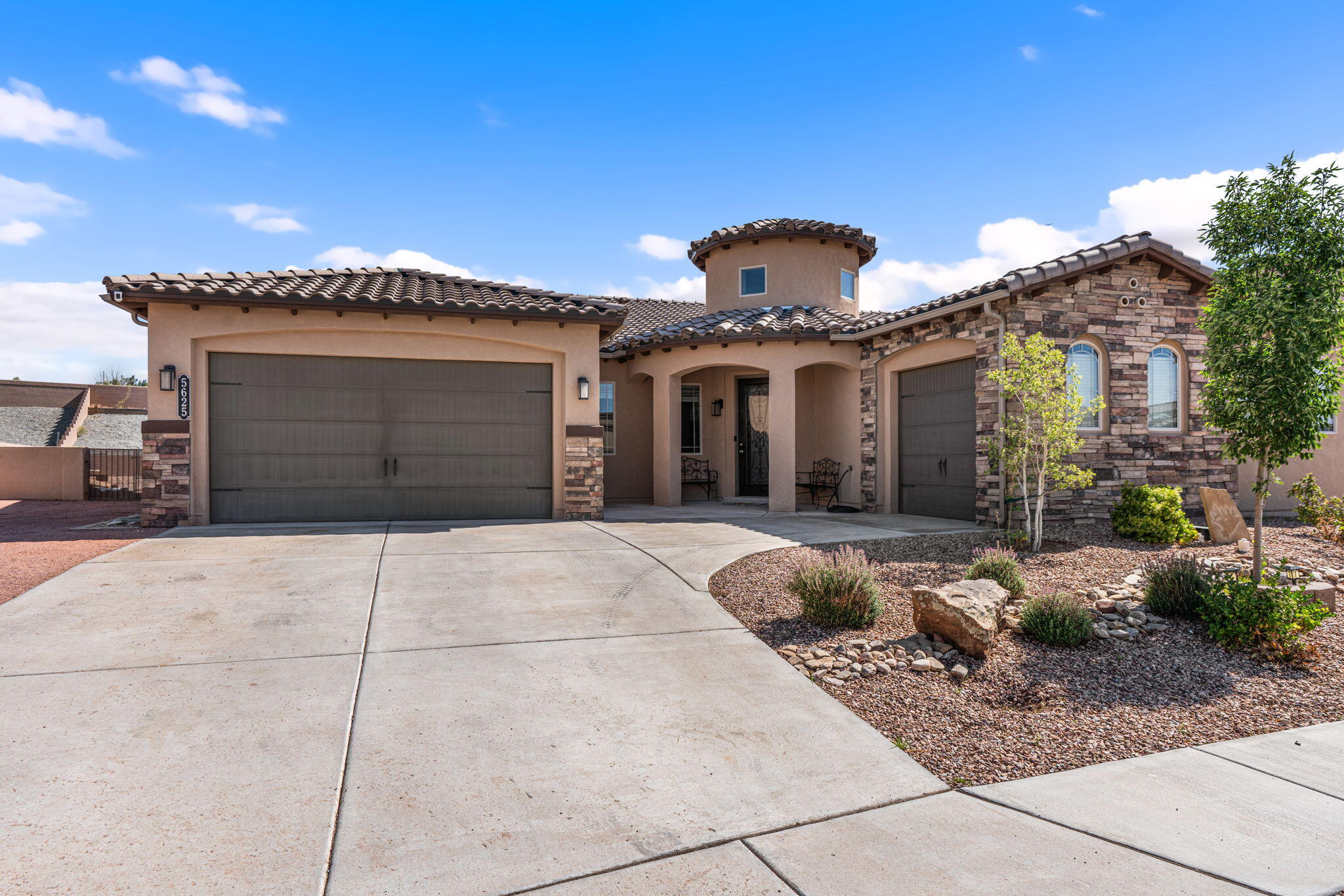 Discover this stunning single-level home in the exclusive Peaks, a gated community within the sought-after Mariposa area, featuring a community center, pools, and dining! A beautiful rotunda entry greets you with raised ceilings and clerestory windows. Enjoy elegant tile floors, raised doorways, and an open floor plan. The gourmet kitchen boasts a spacious island with bar seating, a 5-burner gas cooktop, and granite countertops, seamlessly connecting to the great room with a cozy gas log fireplace framed by stacked stone and a dramatic shadow box cove ceiling! The separate master suite offers a luxurious bathroom with a soaking tub, separate shower, and a walk-in closet linked to the laundry room. Additionally, a large covered patio awaits--there's so much more to explore!