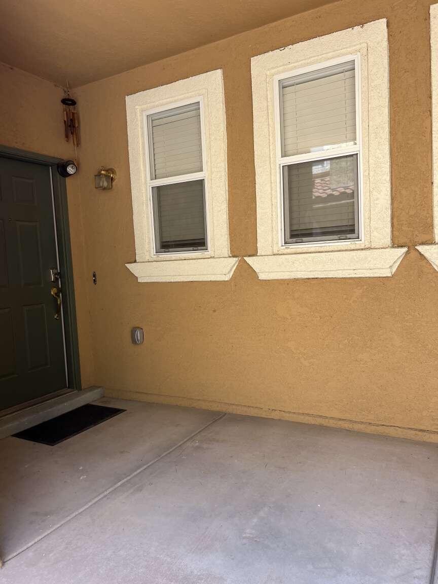 Well maintained townhome in the Menaul Villas. This home is light and bright, with a view of the Sandia mountains from the upstairs master bedroom. The kitchen has plenty of cabinet space along with a large separate pantry and half bath. On the 2nd floor you will find a large master bedroom with a full bath and walk in closet. The second bedroom has a separate full bath. The loft area can be inclosed to make a third bedroom or office. The home has an attached 2 car garage. Off of the sizable living room you will find sliding doors which lead to a nice private patio. On demand water heater provides ample hot water. All appliances convey. Convenient location near freeway access.