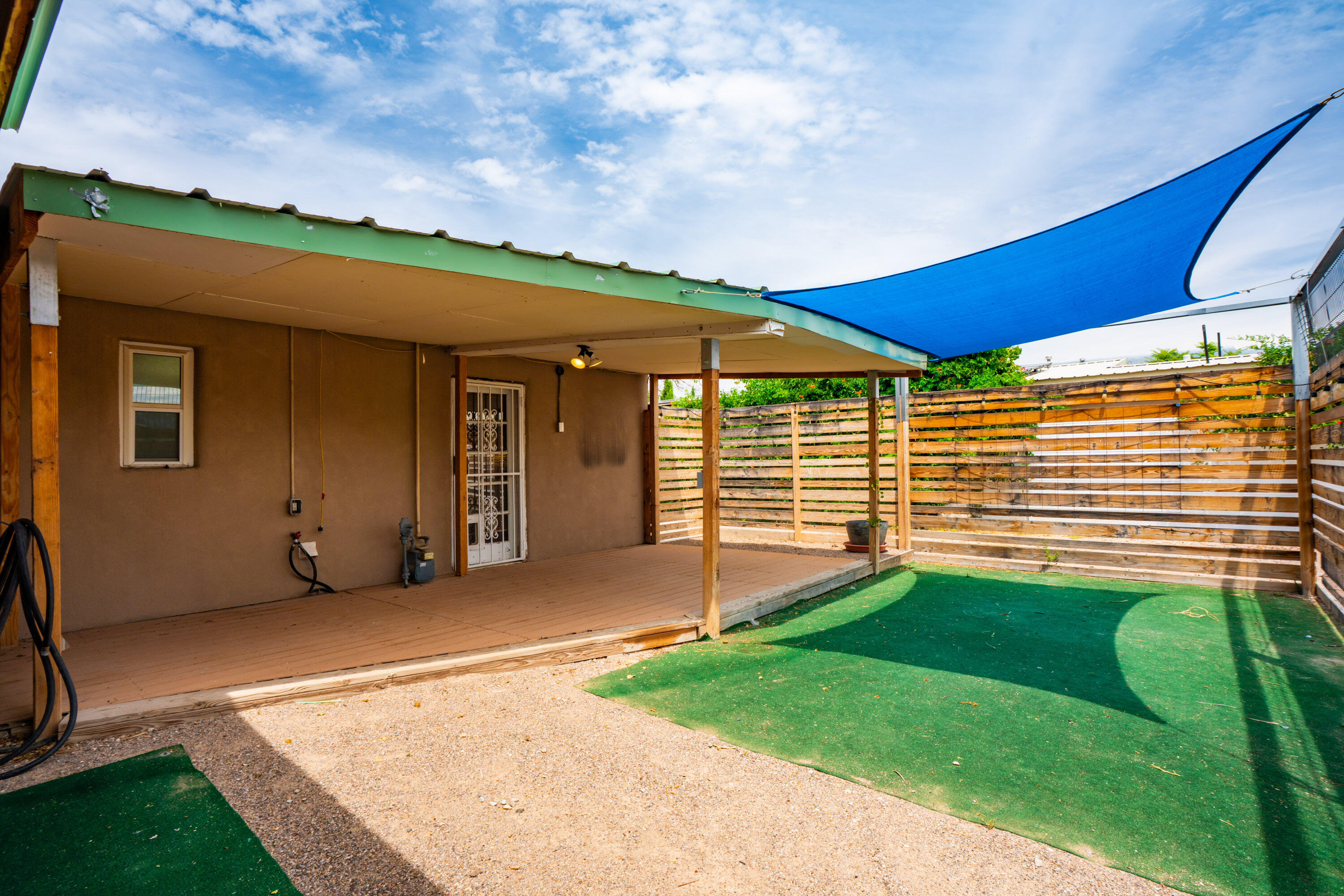 This home features updated windows, roof, heater, fully renovated kitchen with custom cabinets, and refrigerated air at an affordable price! Property also has a privacy wall, gate to front door and a covered patio that is also fenced in. Come see this gem today!