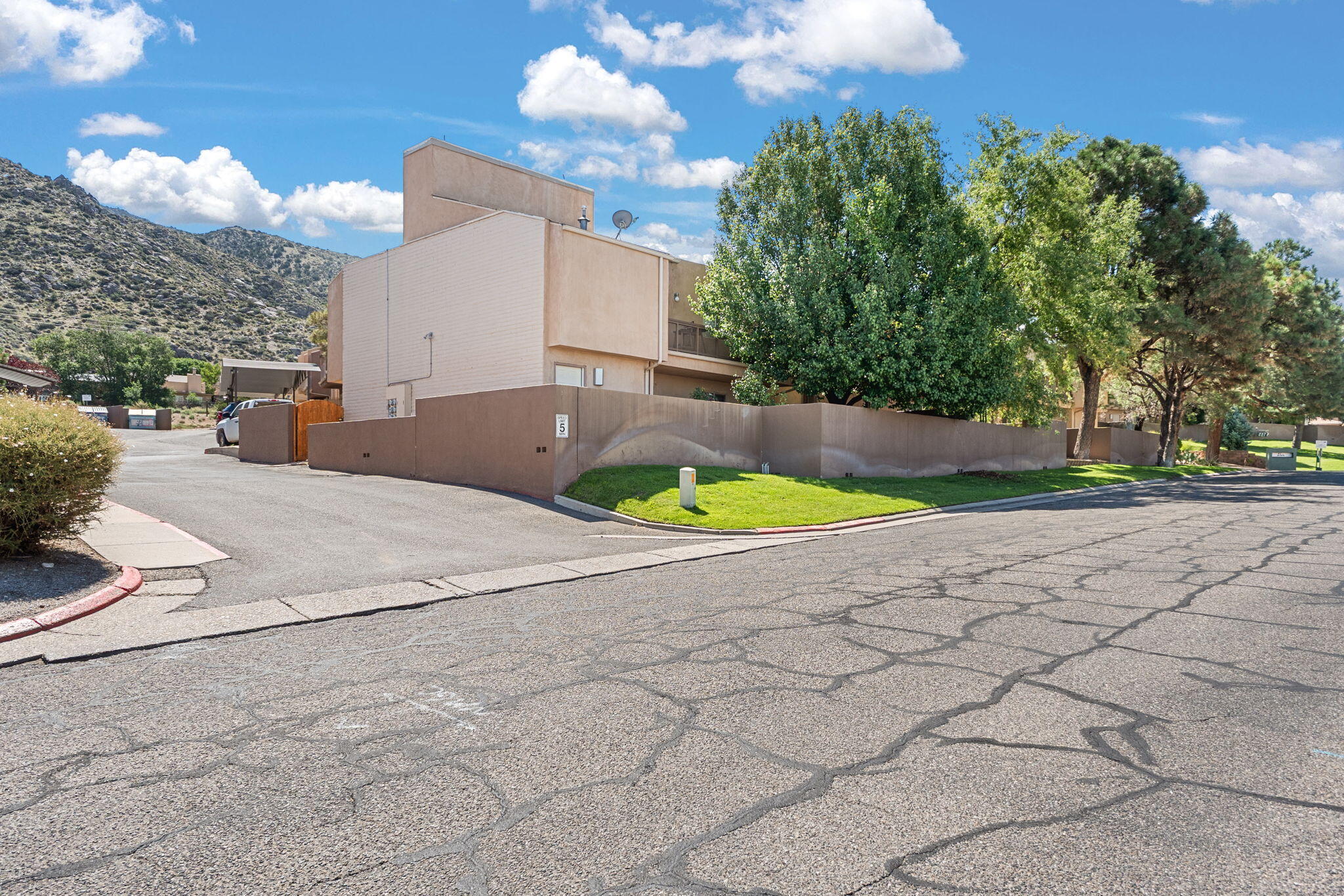 Charmingly quaint condominium located near the foothills of the Sandia Mountains is ready for its next owner!  You'll enjoy exploring what the foothills have to offer with the nearby trails and wildlife.  The home is warm and inviting, creating a homey vibe. All kitchen appliances will convey. It boasts a nicely sized walled backyard along with walled front yard for privacy.  It offers one covered parking spot. Great opportunity to make this your own!  Don't delay, schedule your showing today!