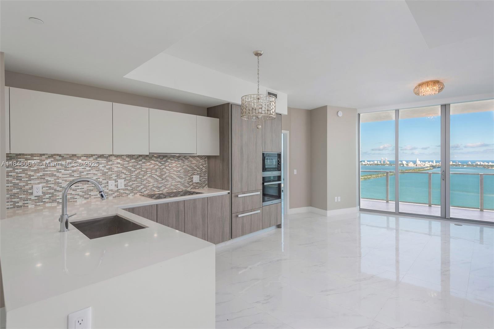 Live in East Edgewater's most exclusive luxury bayfront tower. Beautiful 2 bedroom + Den, 3 full baths on high floor. Direct Biscayne Bay views with Miami Beach and the Ocean in the backdrop. Miele and Subzero appliances, Snaidero kitchen, white quartz countertops. Incredible amenities- Tennis & Basketball courts, state of the art Fitness Center, Spa treatment rooms, sauna & steam rooms, private beach club with day beds, lounges, and individual cabanas, recreation rooms, two pools & hot tub – this is one of Edgewater’s most desirable and luxurious buildings. Currently tenant-occupied until September 2026. Please note that balconies will be closed estimated time frame is October 2025-February 2026.