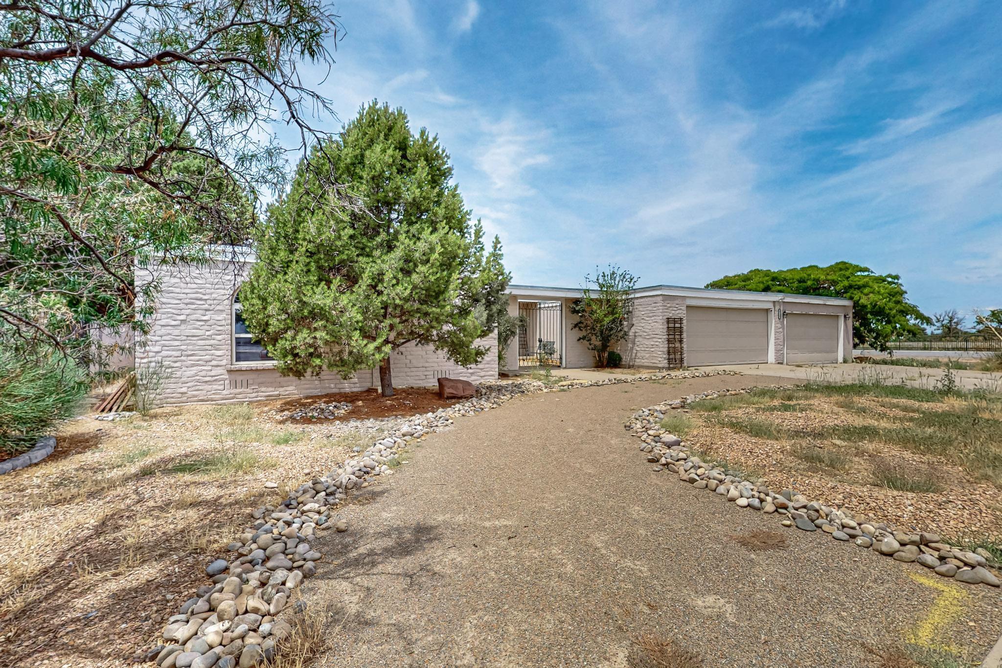 Great location right across the street from Arroyo del Oso golf course and Park with walking and bike paths. Quality Mossman design and constructed home with hardwood floors. Excellent for entertaining with 3 living areas and a buffet/wet bar in the breakfast nook off the kitchen. Sliding glass doors open to a recently installed deck overlooking the pool. Hot Tub is privately located just off the Primary bedroom. The additional one car garage is big enough for two smaller cars or lots of toys. Plus a 22' X 7' storage room.