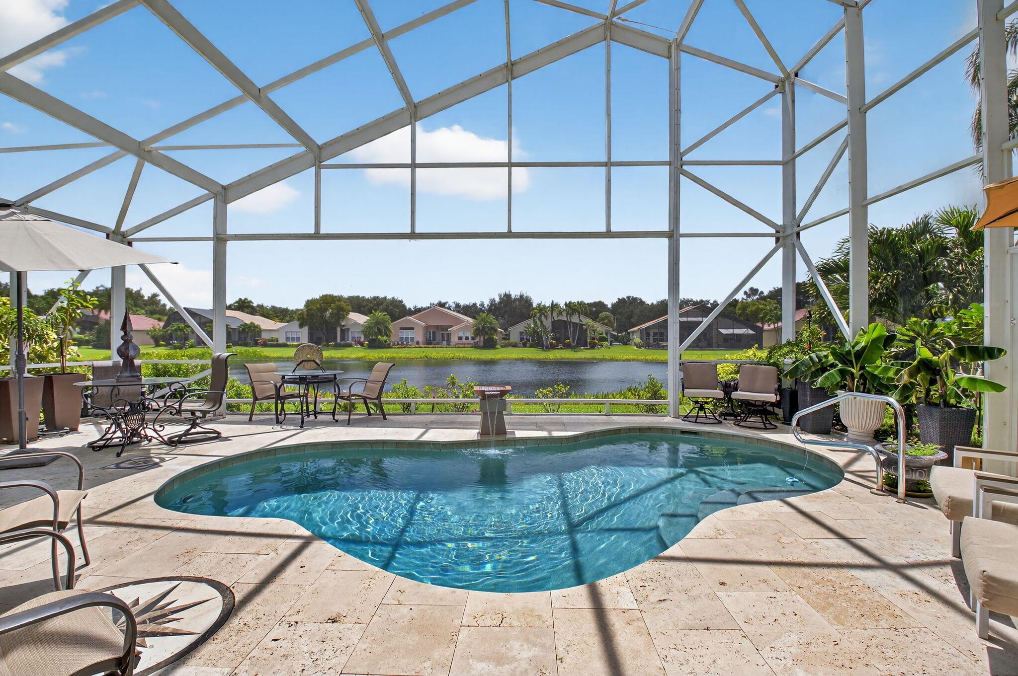 SPECTACULAR MADRID MODEL WITH 4 BEDROOMS, 2.5 BATHS, ON THE LAKE WITH SALT WATER, HEATED POOL WITH HUGE NEW SCREEN ENCLOSURE.  TRAVERTINE TILE SURROUNDING THE POOL. THIS DESIGNER'S HOME IS GORGEOUS!! BEAUTIFUL PORCELAIN TILE FLOORS AS YOU ENTER WHICH EXTENDS INTO THE LIVING AREAS.  KITCHEN HAS NEWER SS APPLIANCES, GAS COOKTOP, DOUBLE OVENS, DISHWASHER, REFRIGERATOR & WATERFALL GRANITE COUNTERTOPS. WHOLE HOUSE GENERATOR. BEAUTIFULLY UPDATED MASTER BATH WITH NEW CABINETS, WATERFALL QUARTZ COUNTERTOPS AND TONS OF STORAGE. TWO WALK-IN CLOSETS.  NEWLY  RENOVATED CLUBHOUSE COMING SOON WITH SPECTACULAR EXPANDED FITNESS CENTER AND CAFE. ALL MEASUREMENTS AND INFORMATION DEEMED ACCURATE AND SHOULD BE INDEPENDENTLY VERIFIED.