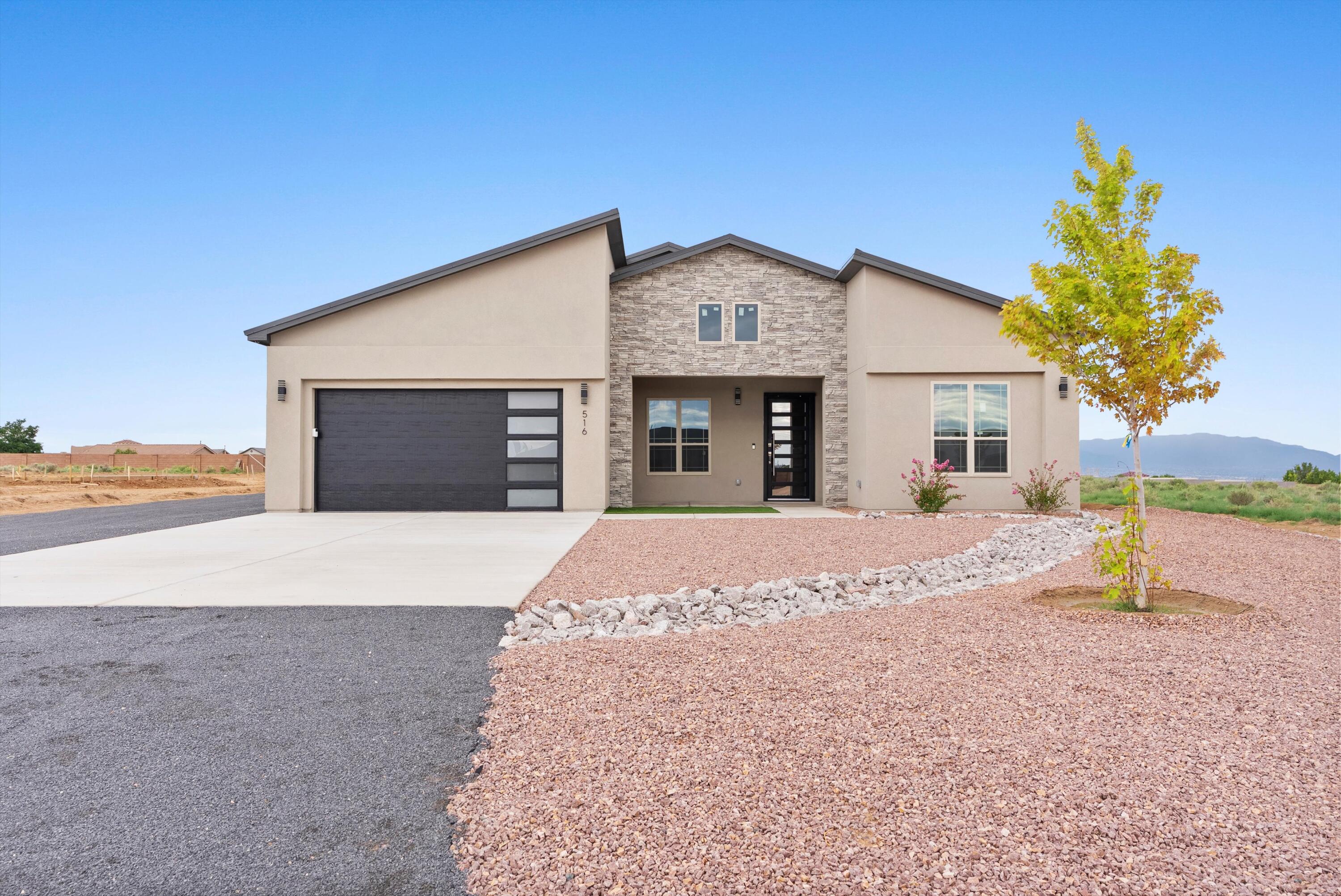 Welcome to this stunning custom-built home nestled on a generous 0.50-acre lot with breathtaking, unobstructed views of the city and Sandia Mountains. Designed for both comfort and luxury, this exquisite residence offers a perfect blend of modern elegance and functional sophistication. Step inside to discover a thoughtfully crafted floor plan featuring three spacious bedrooms and three luxurious bathrooms. The main living area boasts custom, built-in cabinetry and seamlessly connects to a sprawling covered back patio through expansive folding and collapsible glass doors--ideal for entertaining or simply enjoying the stunning mountain vistas. The chef's kitchen is a culinary masterpiece, equipped with an extra large island.