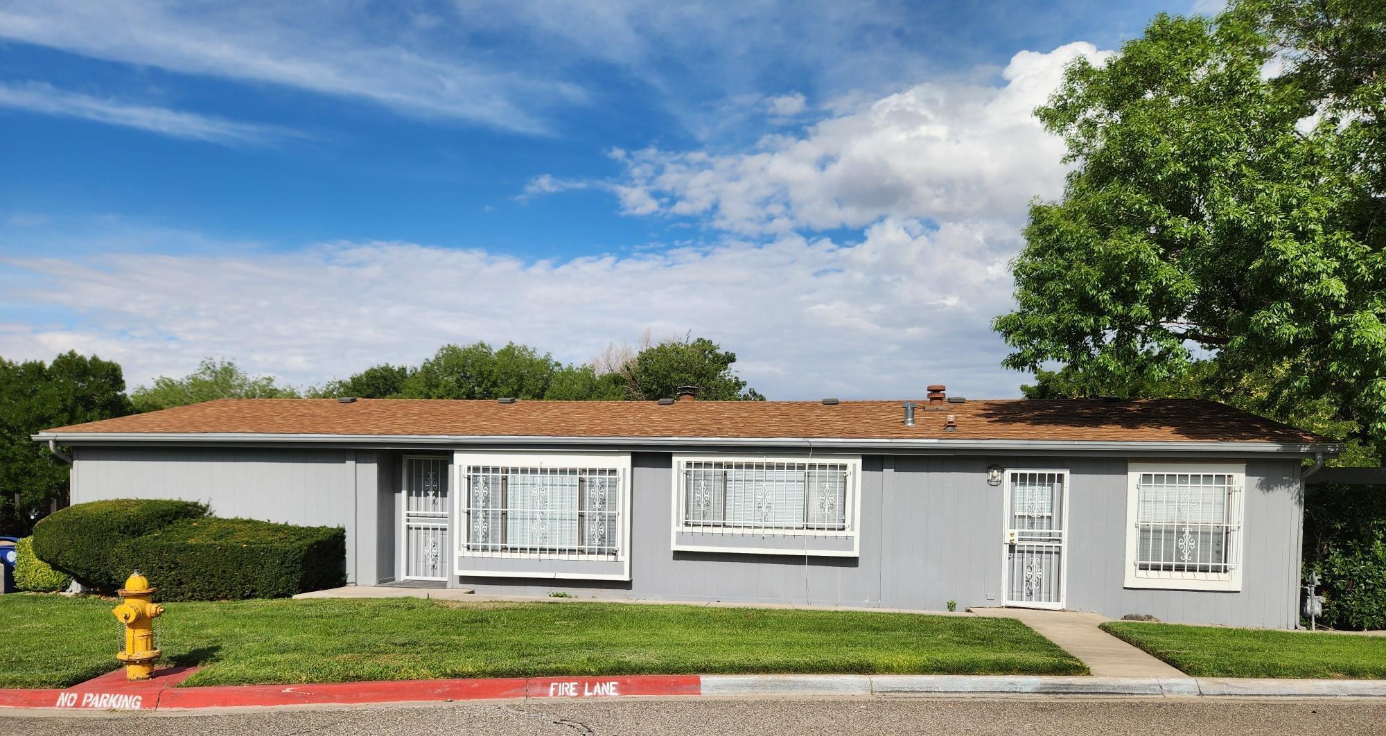 Great location, wonderful home as 2 living areas with a double fireplace, nice open island kitchen and separate dining area, spacious master bedroom plus skylights brings in natural lighting. 3 bedrooms, 2 baths. New flooring, fresh paint Owner will consider owner financing. HOA $200.00 monthly which covers, community pool, water and the grounds. The land is owned on this property, not a land lease. Close to shopping, parks and schools. OWNER FINANCING AVALIBLE.