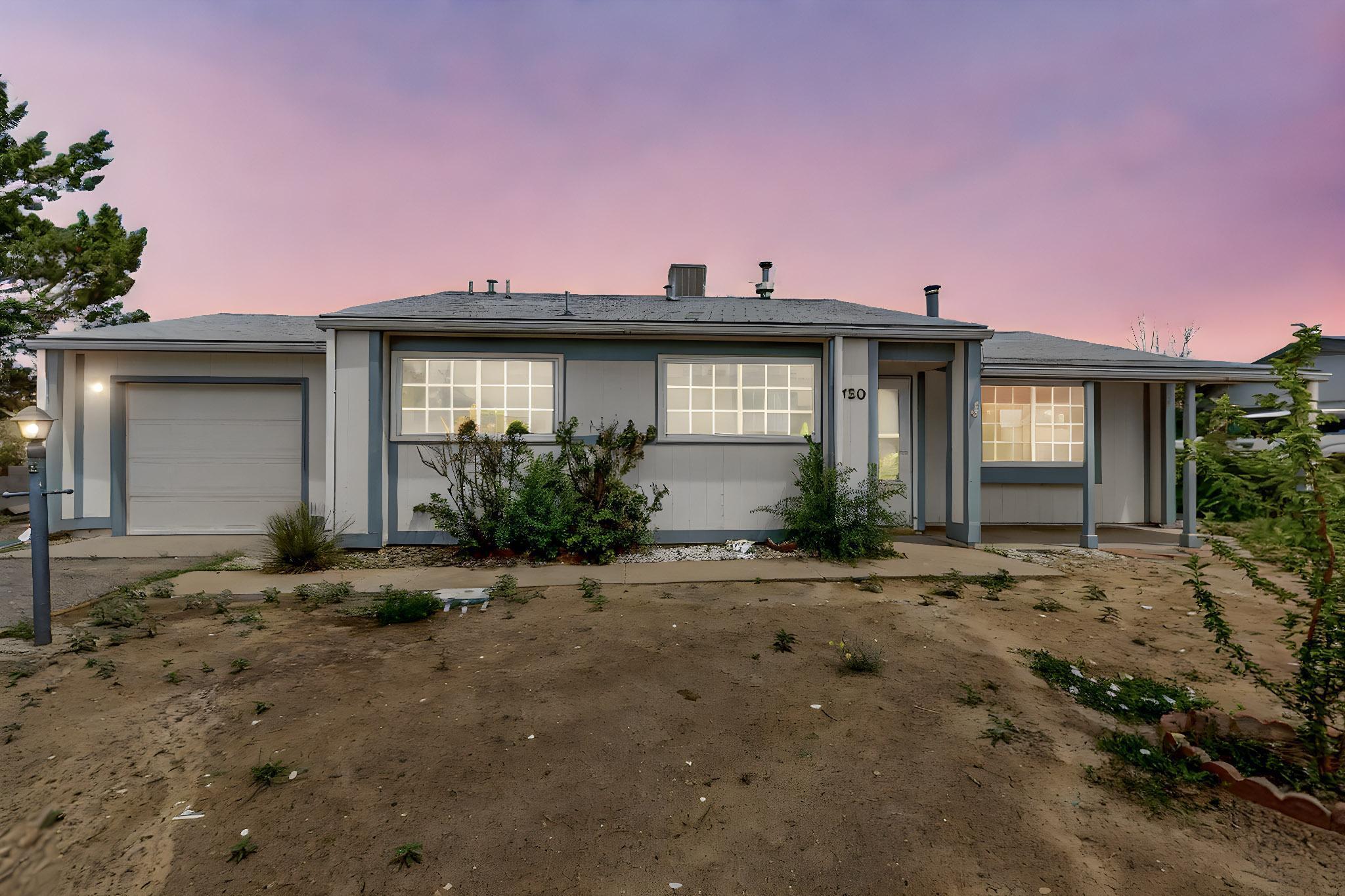 Welcome Home!  Single level cutie in established neighborhood close to everything!Spacious living room with vaulted ceiling, laminate flooring, and wood burning stove.  Practical kitchen includes SS appliances, pantry, breakfast bar and nook.  Full bath with new tub surround.  Large private back yard has vehicle access on BOTH sides with plenty of room for RV parking.  Tons of potential with this little Gem!