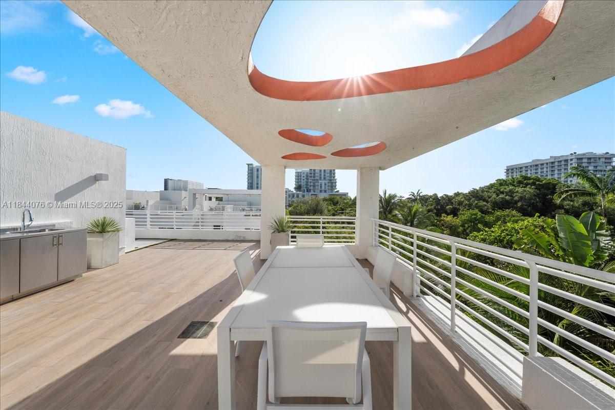 Discover modern living at One Bay Residences, a gated enclave just moments from the Miami Design District. This 3-bed, 2.5-bath home offers 2,236 sqft of interior space plus a 1,495 sqft private rooftop terrace with views over Bay Point’s lush tree canopy—perfect for outdoor living. Enjoy one garage space and a second spot right outside on your private driveway. With low HOA fees, manicured landscaping, and only 38 homes in the community, comfort and privacy come standard. Ideally located near luxury shopping and dining in the Design District and Midtown.