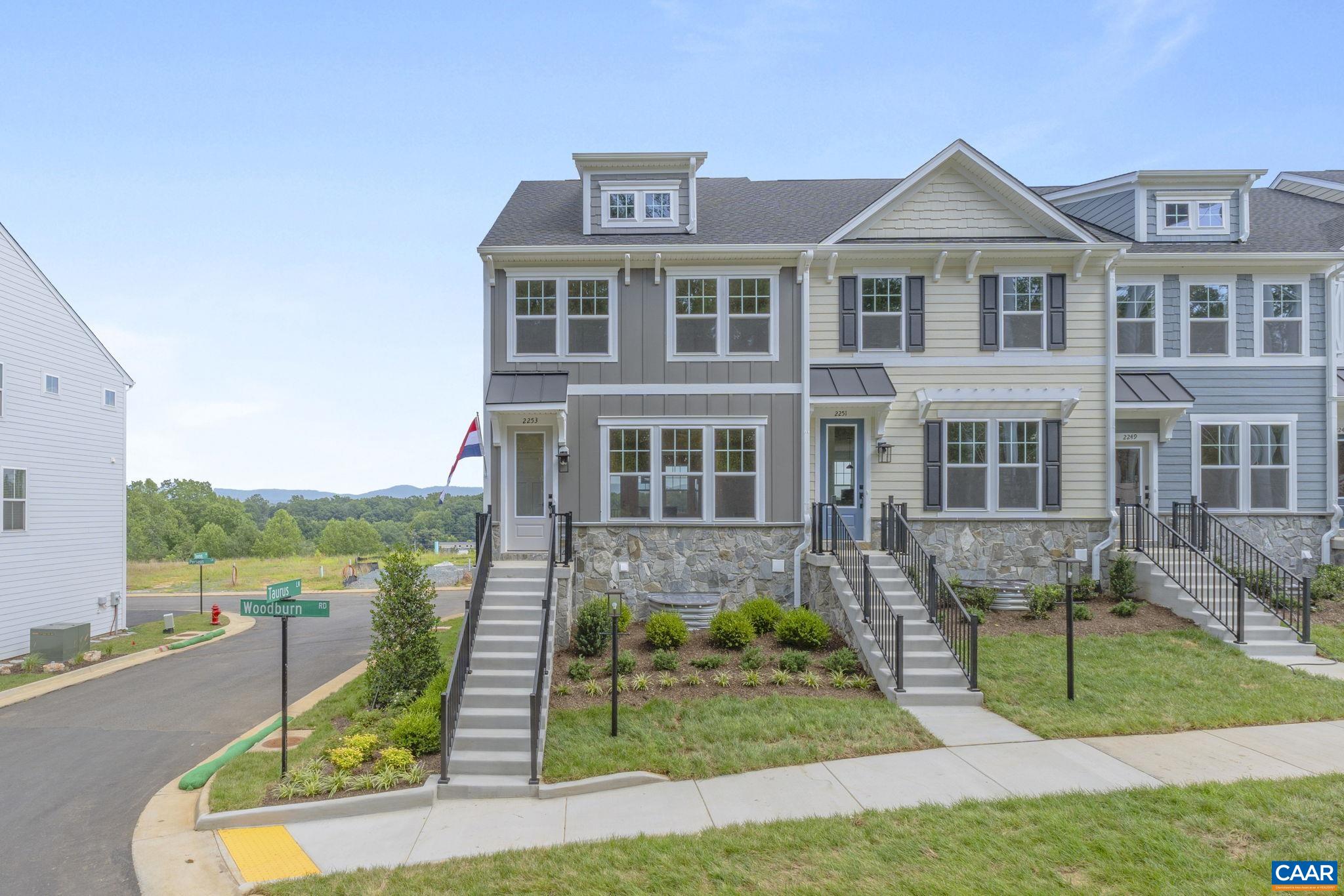 Just completed - this end-unit Dogwood townhome offers 3 bedrooms, 2 full and 2 half bathrooms across 1,890 finished square feet. The entry-level basement includes a versatile recreation room and a half bathroom, along with access to a rear-facing two-car garage. The main level features an open-concept layout with a spacious family room, kitchen with a large island and walk-in pantry, dining area, and a half bathroom. A rear deck extends the living space outdoors. Upstairs, the primary suite includes an ensuite bathroom and a large walk-in closet. Two additional bedrooms, a full hall bathroom, and a laundry area complete the upper level. Originally intended as a model home, this residence includes enhanced design features and upgraded landscaping. Located in the Victorian Heights community, it offers convenient access to Route 29 and nearby shopping and dining options. Actual photos!