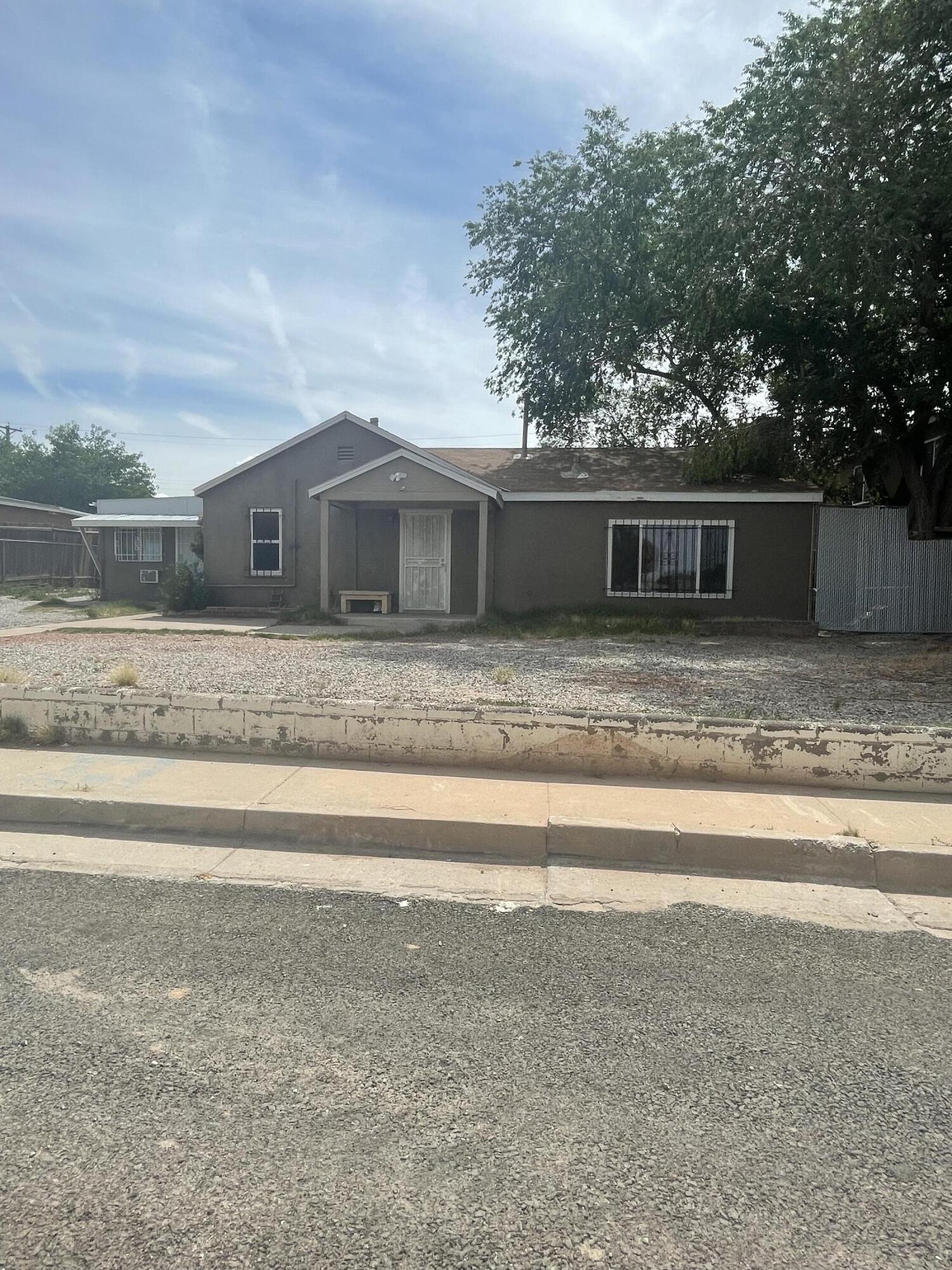 GREAT income producing Investment property!!!  There are 3 units in the property plus a storage warehouse that brings in over $3300 monthly! The large storage unit has a 110 and 220 power supply.  Home is located on a spacious lot with an electronic gate for privacy and security to backyard.  Close to shopping, parks, and Kirtland Air Force Base . Seller is willing to do Owner Financing!!  See LO/SO for details on REC Terms.  Bring your investors to this income producing property.