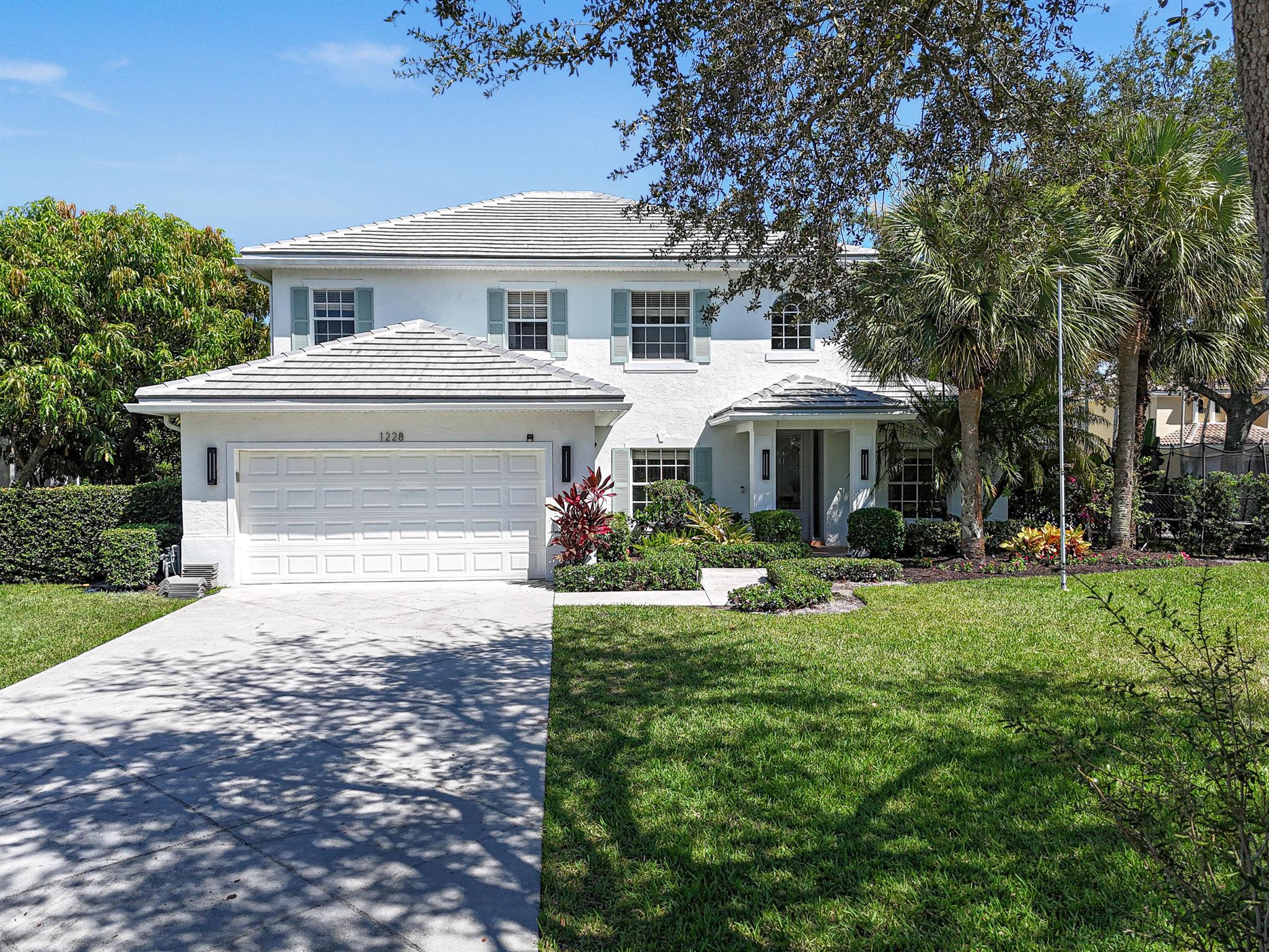 Welcome to this spacious and thoughtfully designed 4-bedroom, 3-bathroom home with a dedicated office/play room within the sought after community of Egret Landing. You will enjoy a BRAND NEW ROOF July 2025. and a WHOLE HOUSE GENERATOR. The kitchen has been completely renovated with white and gray shaker soft close cabinets/drawers, quartz countertops, and stainless steel appliances. All 3 bathrooms have also been tastefully updated. The primary oversized suite includes a large walk-in closet and a beautifully appointed en suite bathroom with dual vanities, a bathtub and separate shower. Outside enjoy your own backyard retreat with a new sparkling pool, marble  paver patio, and space for outdoor dining and play. Whether you are hosting friends or enjoying a quiet evening, this backyard is ready for all of life's moments and fully fenced in.  1228 Egret Cir S is located in a desirable location near the community amenities.  You will also be close to A rated schools, parks, golf, shopping, spring training, PBI Airport, restaurants, and Jupiter/Juno Beach.