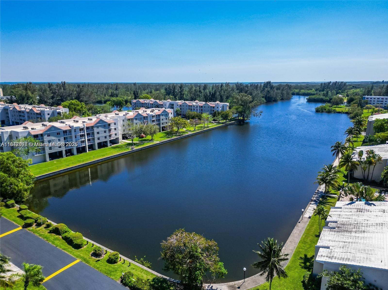 LARGE and NEWLY REMODELED 2 Bedroom 2 Bath with a waterfront backdrop located in Cutler Bay's  gated community "The Cove Condominium". This nearly 1,200 sq ft. unit has new wood flooring throughout, Brand New Kitchen, Stainless Steel Appliances, New Kitchen Cabinetry, Countertops and Backsplash, Updated Bathrooms and Central A/C replaced in 2020.  Start your morning enjoying coffee on the screened balcony or doing Yoga while appreciating the garden views. The unit has a very nice split-plan layout with an open concept that is light and bright.  There's 1 assigned parking space, lots of guest parking, swimming pool and so much quiet. Condo has RESERVES. Owner is motivated and open to providing financing.