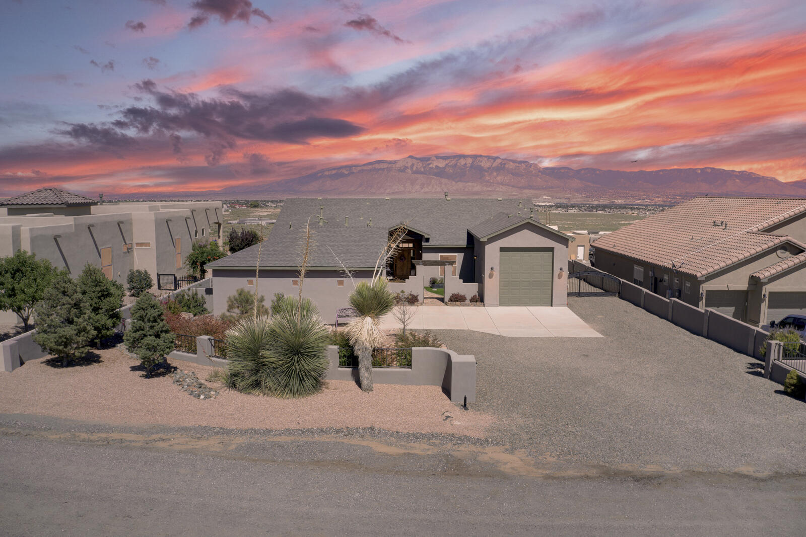 This Stunning and Immaculately kept Custom Home was expertly designed to take advantage of spectacular Mountain and City Views. The entire half acre property is beautifully landscaped. There is a perimeter block wall and metal gate for backyard access. Enjoy sunrises and sunsets from the large patio with fireplace, pond and firepit. Inside the home, the spacious and open floor plan features beautiful tile flooring throughout, impressive wood and beam ceilings in the living and dining rooms, kitchen with custom cabinets, stainless steel appliances, rich granite counters and large pantry. The primary bedroom and bath are a dream with views, double vanities, large custom tile walk-in shower, free standing tub and fireplace. There is a second primary bedroom in a separate wing for privacy.