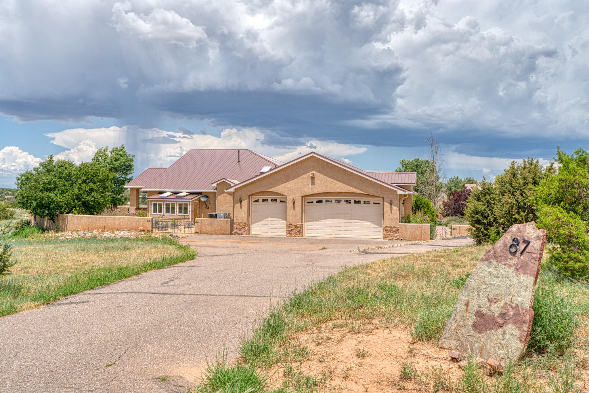 Custom single story home with tons of custom features and upgrades. Entranosa Water.  Custom cabinets and Granite Countertops in the Kitchen and Bathrooms from Davis Kitchens.  Spacious Kitchen with Center Island, Electric Cooktop(gas stub also available in cabinet), Custom tile backsplash, custom lighting, two skylights and a Breakfast Bar.  Large Pantry with custom adjustable shelving.  Vaulted Ceiling in the Living/Dining Room.  Primary Suite with two walk-in closets, two separate bathroom vanities and a separate shower and tub. Custom shelving and storage in both closets.   Access to Solarium from Primary Bedroom. Three bedrooms and an office/study/home gym/bedroom.  Large utility room with custom cabinets for additional storage. Much more!!