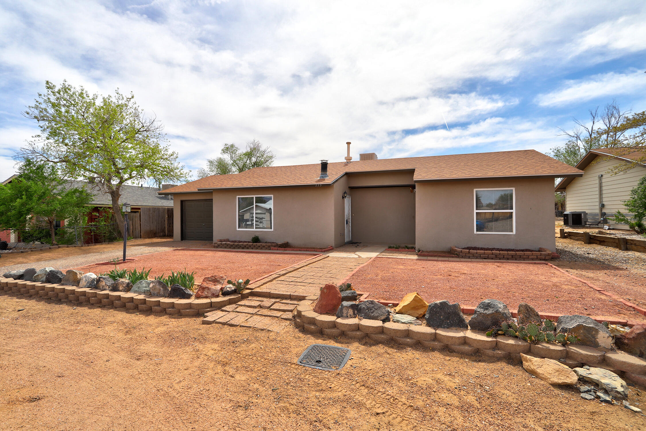 Charming 2 bedroom 2 bath, 1 car garage, single story home in the heart of Rio Rancho. Recently updated with new LVP flooring, new carpet in the bedrooms, and fresh interior paint throughout. This home offers an open layout with a spacious living area and country kitchen. The kitchen features new SS appliances and has french doors leading to the backyard. Lots of space in the backyard for outdoor fun or relaxing weekends. This affordable home is great for First Time Homebuyers looking for comfort, style and value in a friendly community. You don't want to miss out on this opportunity!
