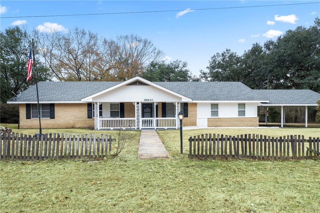 This delightful residence is nestled on a 2+ acre corner lot adorned with beautiful oak trees, offering both charm and tranquility! It features three bedrooms, two bathrooms, and a bonus room that presents endless possibilities, ideal as a playroom or just additional living space to relax or entertain. The expansive laundry area ensures ample room for all your essentials and then some. The living room showcases a cozy wood-burning fireplace, and no carpet throughout the home is a plus. The outdoor space creates a serene atmosphere that can be enjoyed from the screened-in porch. There is a large workshop perfect for DIY projects, and a wonderful gardening area. With a quick and easy commute into town, to Bogalusa and Covington, this property is conveniently located and provides a peaceful atmosphere away from the hustle and bustle. Don't miss your chance to make this charming place your own!