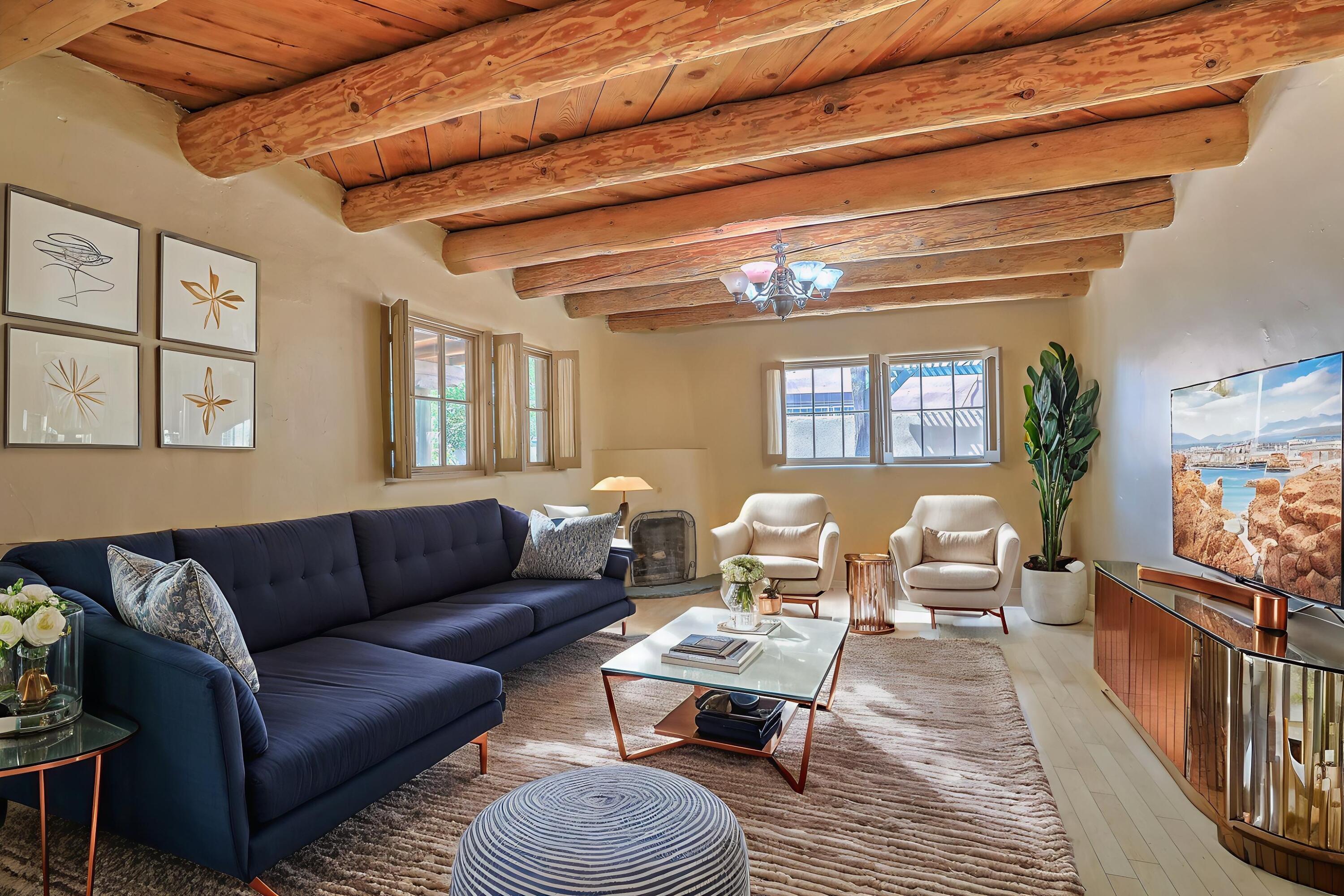 One-of-kind property in a one-of-kind location!  This Watson adobe home is steps away from Tiguex Park, Old town, museums, the Abq Bio Park, shops and eateries. Incredible, walkable location on a private, tree-lined street.  The home itself has been beautifully updated and lovingly maintained, while keeping it's old-world charm.  Y'all will love the hardwood floors, tongue-in groove ceilings with large viga timbers, and the woodburning kiva fireplace.  The open, eat-in kitchen boasts modern amenities such as stainless-steel appliances, and granite countertops.  The screened in porch, covered patio and heated and cooled outbuilding provide additional flex spaces.  If you want a home with authentic New Mexican character, this is the one you have been waiting for!