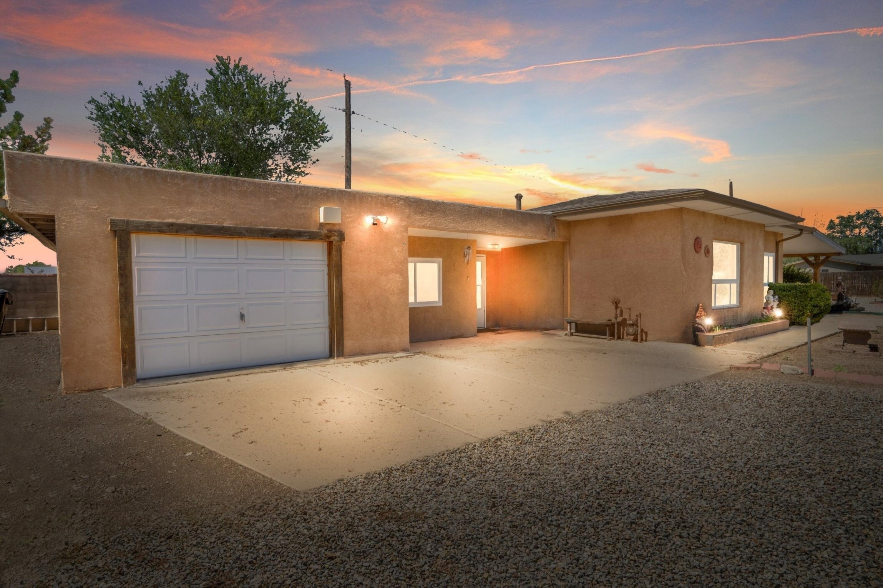 North Valley Charmer on G Lane - Spacious Lot, Flexible Layout & Upgraded Features. Welcome to this inviting 2-bedroom, 1-bath home on peaceful G lane in Albuquerque's beloved North Valley. Offering warmth, character, and flexible space, the home features a bonus secondary living area with potential for a 3rd bedroom. The home sits on an approximately .18 lot (buyer to verify), with mature trees and plenty of outdoor space. Inside you'll find a quaint kitchen ready for your new memories and meals, newer storm door and windows, and a washer, dryer, and refrigerator included. Climate comfort is provided by a Williams-style gas heater in the living area and evaporative cooler located in the garage, ducted to one bedroom. Roofing includes a pitched shingle roof (warranty through