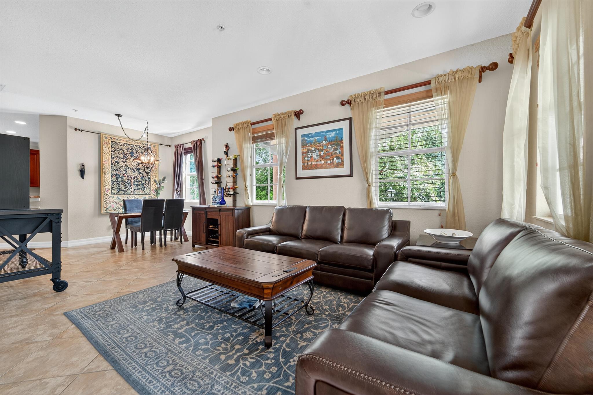 Spacious 3-bed, 4-bath end-unit townhouse with 2-car garage in sought-after Botanica. This rare corner unit boasts one of the largest wraparound yards--perfect for private outdoor gatherings. The ground floor features a flexible office or potential 4th bedroom with a half bath. The second floor offers a fully renovated kitchen with granite countertops, bar seating, dining area, breakfast nook, and another half bath. Upstairs you'll find 3 bedrooms, 2 full baths, and a laundry room. Includes impact windows, a newer roof, and large garage. Community pool and green space are right across the street.