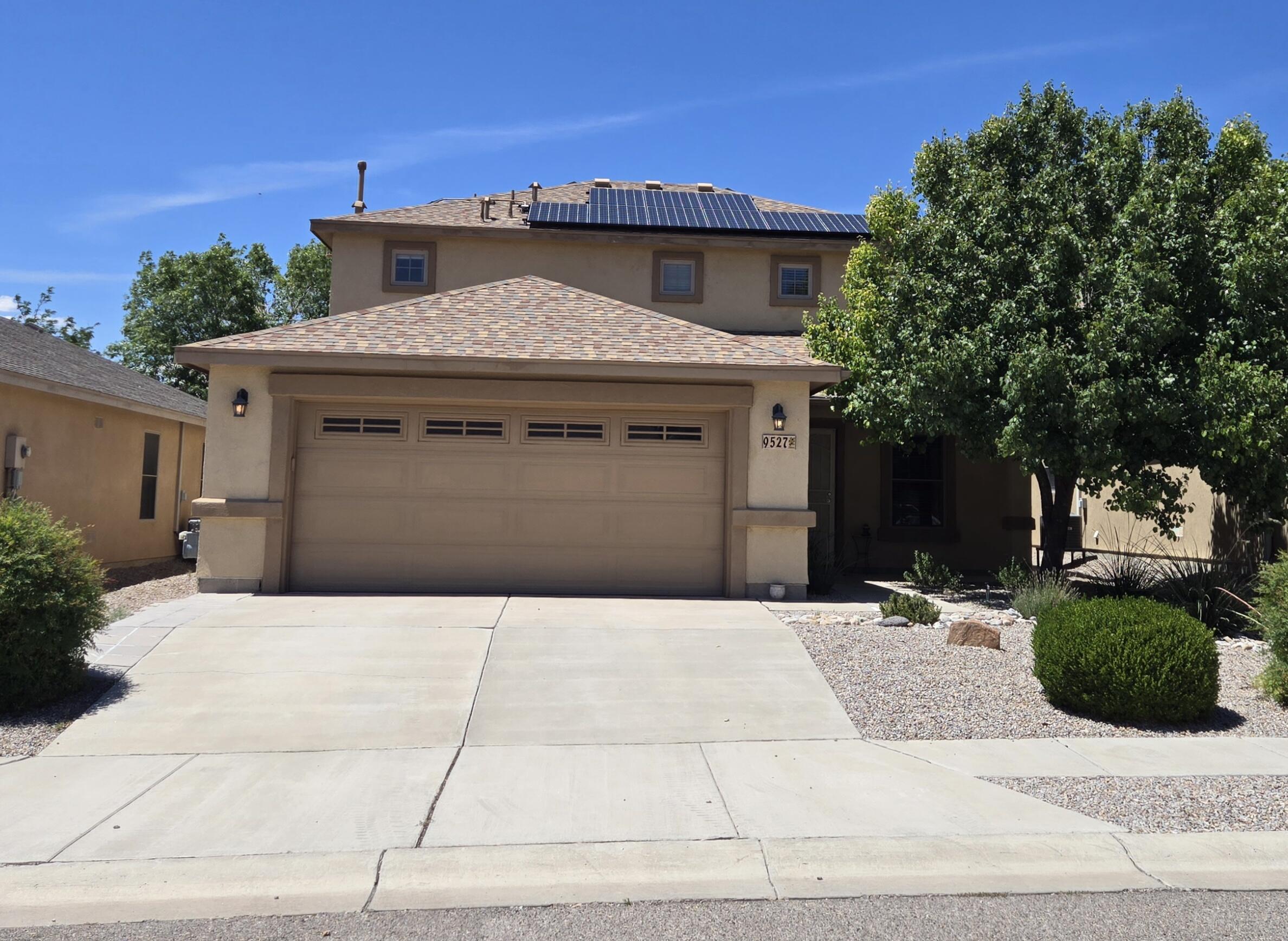 Clean, fresh & move in ready! 2 story, 3/3 home w/ REFRIGERATED air, 2 living spaces & PAID OFF SOLAR! Nicely kept subdivision w/ easy access to Paseo. Walk in to the front living space that opens to a spacious 2nd bonus living area. Any sized furniture, TV, pool table! Living is open to the dining area & pretty kitchen. Kitchen has granite counters, stainless appliances, gas stove, bar for stools & a pantry. Space for a dining table as well!  Half bath & laundry room are downstairs w/ another large storage pantry closet.  Upstairs are the 3 bedrooms with bamboo flooring. NO Carpet! Primary is spacious w/ a large walk in closet, full bath w/ a 2 sink vanity. Extra storage as well. Down the hall are the 2 spare bedrms, full spare bathroom. Yards are low maint, shed in back, covered patio!