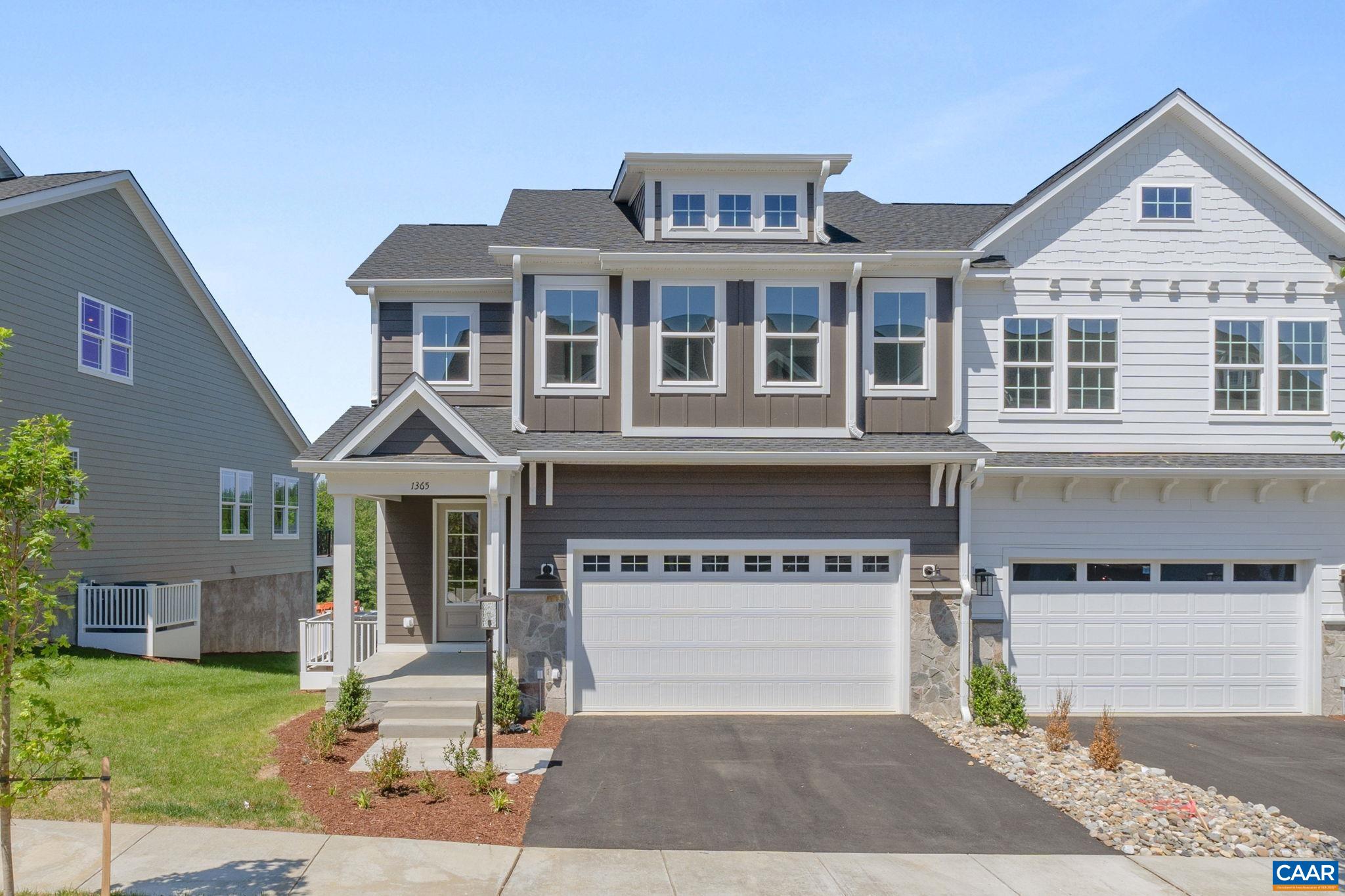 Located in The Grove at Brookhill, this end-unit Bayberry villa offers low-maintenance living with easy access to Route 29 North in Charlottesville. The main level features a spacious primary suite with a private bath and walk-in closet, along with an open-concept layout that connects the kitchen, dining, and living areas. The kitchen includes a walk-in pantry, soft-close cabinets, and quartz countertops, while the family room features an electric fireplace. A mudroom and laundry area add everyday practicality. Upstairs, two additional bedrooms, a full bath, a loft, and a pocket office offer flexible space and plenty of storage. A large deck off the main level provides a great spot for relaxing or casual entertaining. Additional features include luxury vinyl plank and tile flooring in the main living spaces, modern design, real stone exterior accents, and a two-car garage. With the future Brookhill Town Center nearby, shops, restaurants, and walking trails will soon be close to home. Actual photos.