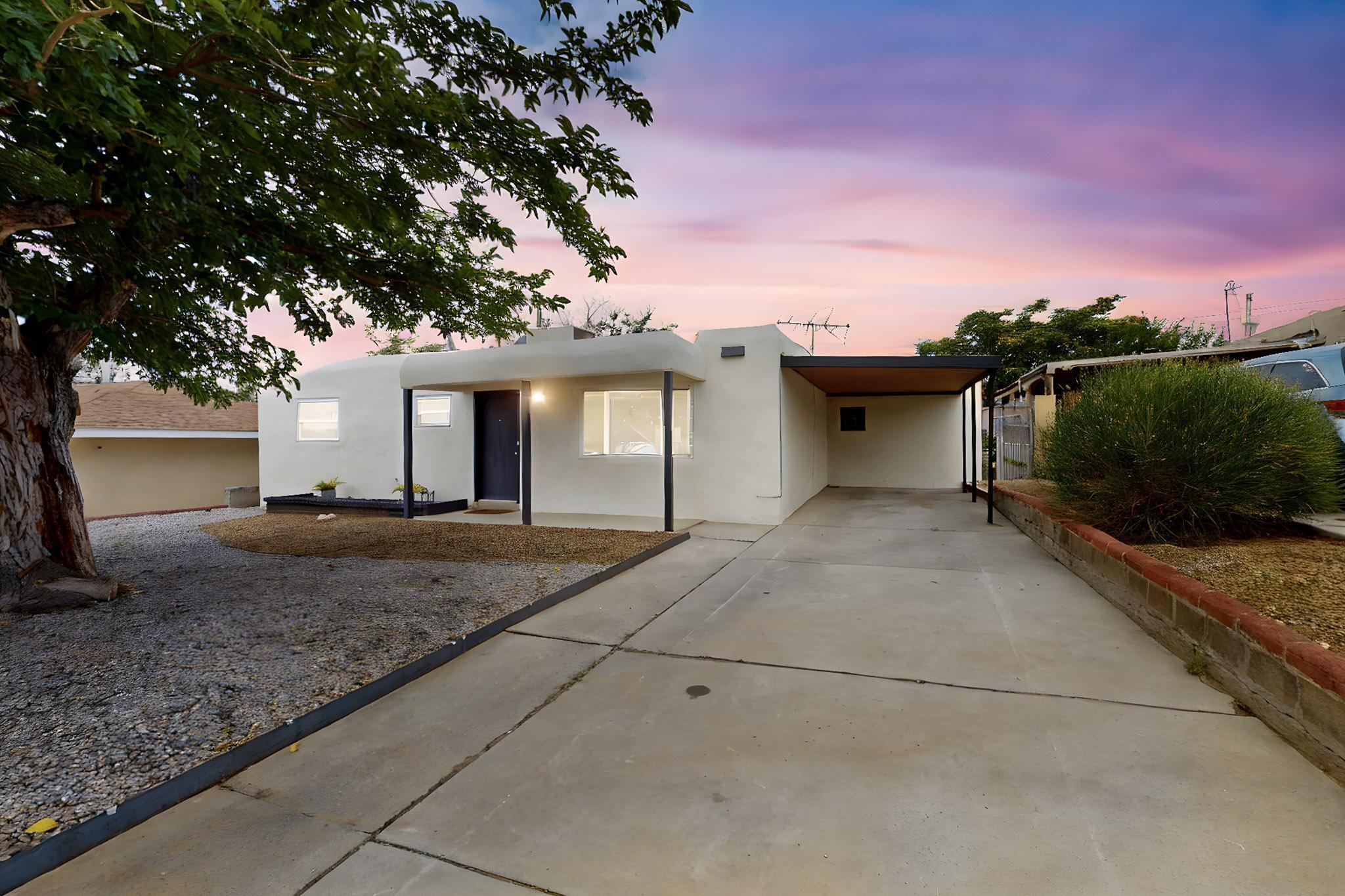 Come see this charming home in Albuquerque's Uptown neighborhood. This beautifully remodeled 3-bedroom, 2-bathroom home has a nice open floor plan, providing a spacious feel in the living and kitchen areas. This updated kitchen features a walk-in pantry as well as custom cabinets, quartz countertops, a new stove, and dishwasher. Find tiled backsplash, glass doors, and built in nichos in the showers and quartz countertops. New ceiling fans in the bedrooms. Walk-in closet with built-in shelving and custom metal barn doors in the primary bedroom. The primary bedroom also has a newly added mini split unit. The home has been restuccoed and includes new doors and trim in the interior. Schedule your showing today!