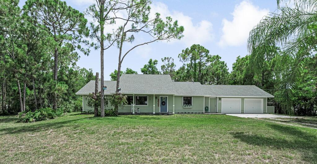 Home Sweet Home ! Welcome to this much loved and  well maintained 4 bedroom 2.5 bath home close to shopping, schools and restaurants  but yet offering a quiet place to call home.Peace of mind will be yours with a brand new roof (2025) Hurricane-rated garage doors (2024) Hurricane- rated accordion shutters (2023) Hurricane-rated exterior doors (2022) all this along with Anderson Brand double paned windows and sliders. Inside you will find a spacious living room  that leads into an open dining room and kitchen that is perfect for holiday and weekend gatherings.