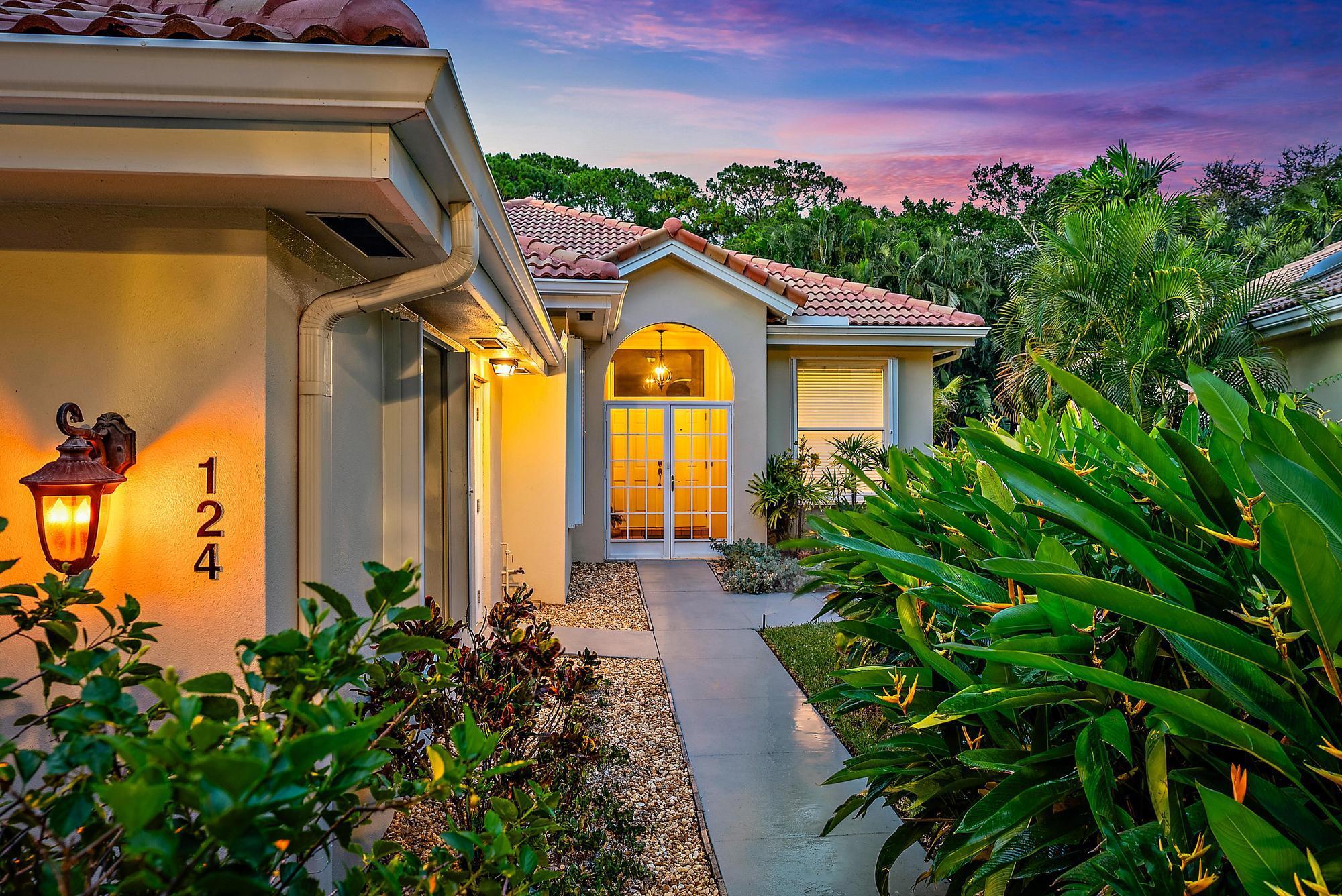 Welcome to this beautifully maintained DiVosta-built home in the desirable Hamptons at Maplewood, nestled in the heart of Jupiter. This solid CBS-constructed residence offers 3 spacious bedrooms, 2 full bathrooms, and nearly 2,000 square feet of thoughtfully designed living space, blending comfort, elegance, and functionality. From the moment you step inside, you'll be welcomed by elegant crown molding, tasteful architectural details, and the timeless appeal of tile flooring throughout--all beautifully framed by a light-filled, open floor plan. The kitchen is a true centerpiece of the home, featuring upgraded cabinetry, a striking waterfall-edge quartz countertop, and newer GE appliances that make cooking and entertaining a pleasure. Seamlessly connected to the dining and living areas, the layout flows beautifully toward the large sliding glass doors that open to the outdoors&#x14;perfect for alfresco dining, weekend gatherings, or simply enjoying the Florida breeze in your own private retreat.

The spacious primary suite offers a peaceful haven, filled with natural light from large windows and designed with relaxation in mind. The spa-inspired en-suite bathroom includes a luxurious soaking tub, a walk-in shower, dual vanities with elegant fixtures, and a skylight that bathes the space in soft, natural light. Each guest bedroom is generously sized and equipped with custom built-in closet systems, offering comfort and practical storage.
Additional features of the home include full hurricane protection, with impact sliding doors and accordion shutters on all windows for peace of mind during storm season. The well-equipped laundry room provides ample cabinetry and marble countertops, while a two-car garage and accessible attic deliver even more storage solutions.

Step outside to discover your own private backyard sanctuary, where a tranquil preserve provides a lush and peaceful backdrop. Whether you're sipping coffee in the morning or hosting friends in the evening, the outdoor space offers the perfect setting for quiet relaxation or lively gatherings.

The Hamptons is a charming, tree-lined community with low HOA fees, winding shaded sidewalks perfect for biking, jogging, or evening strolls. Centrally located in the Town of Jupiter, residents enjoy convenient access to nearby dining and entertainment in Abacoa, I-95, and the area's world-class beaches. This home truly offers the best of South Florida living in one of the area's most beloved neighborhoods.