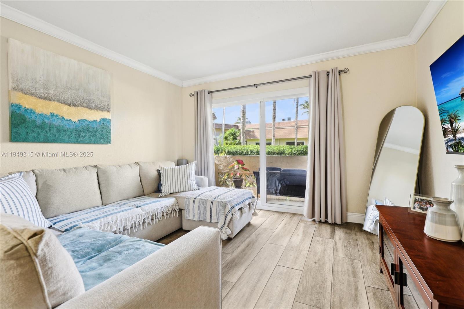 Prime Palmetto Bay location! This first-floor corner unit offers privacy and convenience just steps from Publix in a well-maintained, clean building. Enjoy newer floors, impact windows, and a spacious patio overlooking the recently renovated pool. The condo is tastefully updated and move-in ready. Showers are newly tiled. The closets are professionally installed and all closet spaces have LED lighting throughout. New A/C recently installed. Surrounded by beautiful homes in a great neighborhood. Includes 2 assigned parking spaces. A rare opportunity in a sought-after area—don’t miss it!