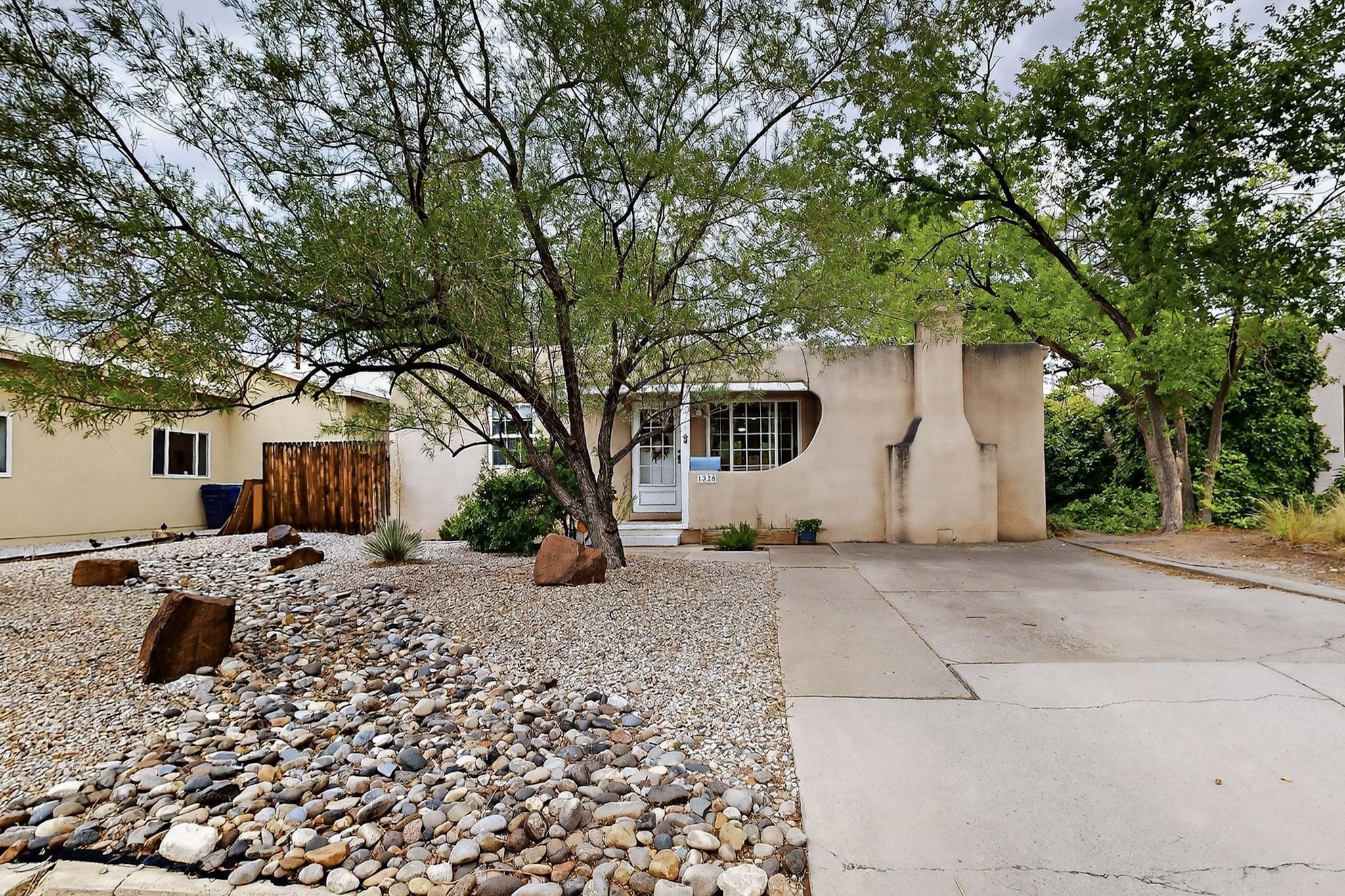 Beautifully updated 2 bed, 1 bath home located just blocks from UNM's Law and Medical Schools. Features include a fully renovated kitchen with modern finishes, a spacious family room with a wood-burning fireplace, and a remodeled bathroom. Recent upgrades include a TPO roof (2021), newer windows, and a freshly installed drip irrigation system in the landscaped backyard. Enjoy classic charm with functional updates throughout. Ideal for owner-occupants, students, or investors seeking a prime location and turnkey condition.