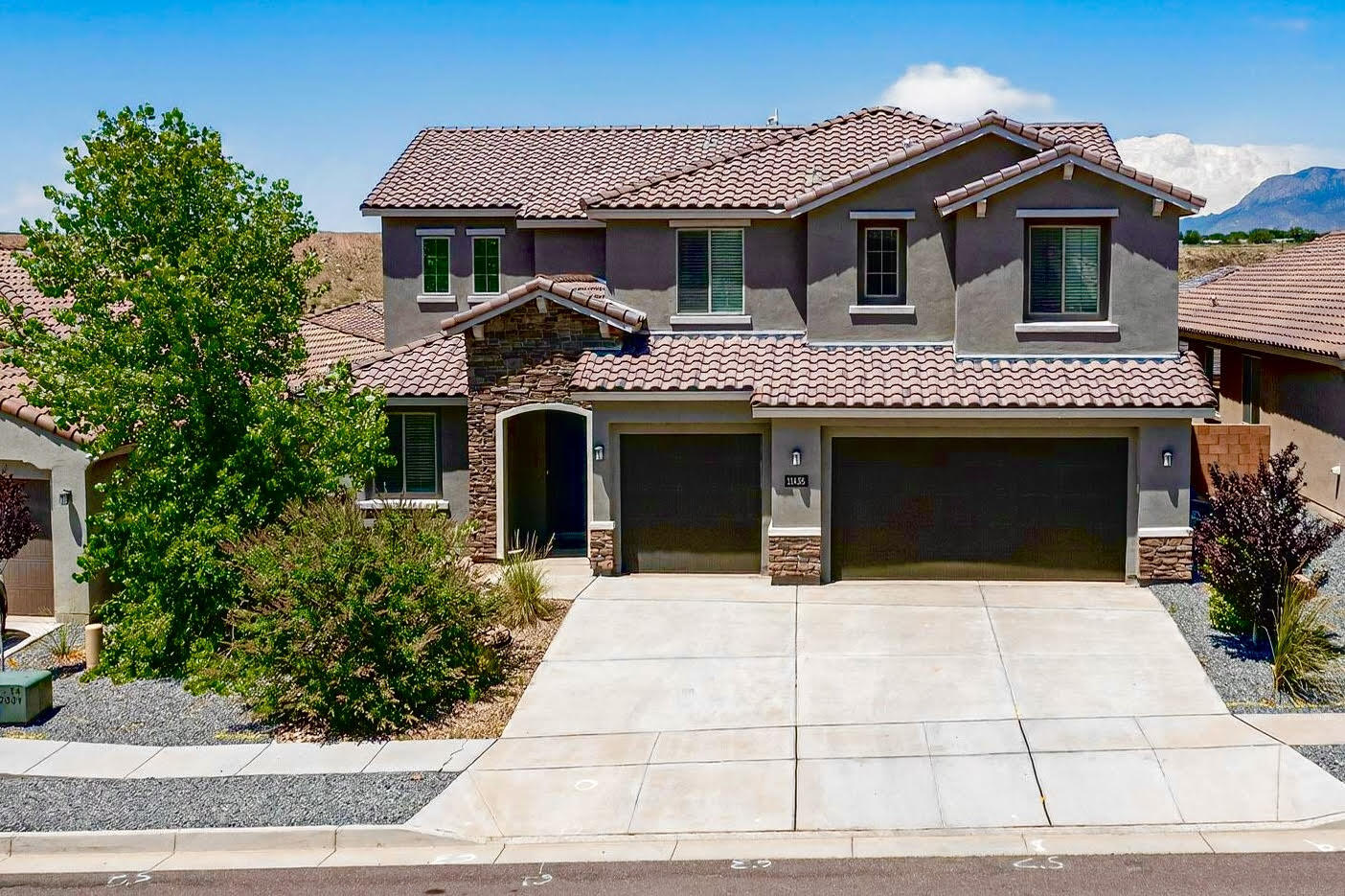 Stunning 6-bedroom, 5-bath home in desirable Volterra subdivision! Built in 2021, this former Pulte model home blends modern elegance design and high-end finishes. The main floor features a primary suite, walk-in shower, and large closet, plus an additional guest suite, and office space.The open-concept kitchen, dining, and living areas are filled with natural light. Upstairs offers four more bedrooms, two full bathrooms, and a large loft space - great for a home office, game room, or media lounge.Enjoy year-round outdoor patio, low-maintenance backyard. Additional highlights include a 3-car garage, refrigerated air, tankless water heater, tile roof. Comes with appliances. Easy access to shopping, Kirtland AFB, and major commuter routes.Don't miss your opportunity to own it!
